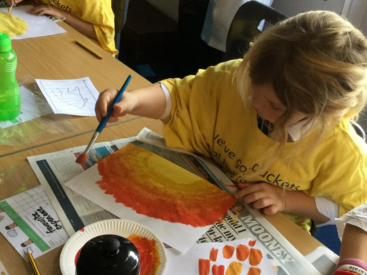 Paint. Mixing warm colours for backgrounds