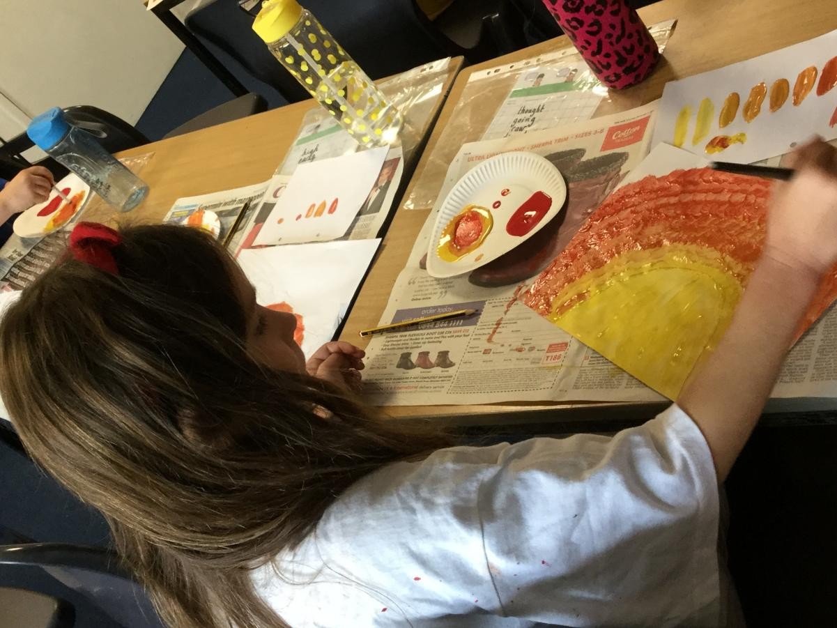 Paint. Mixing warm colours for backgrounds