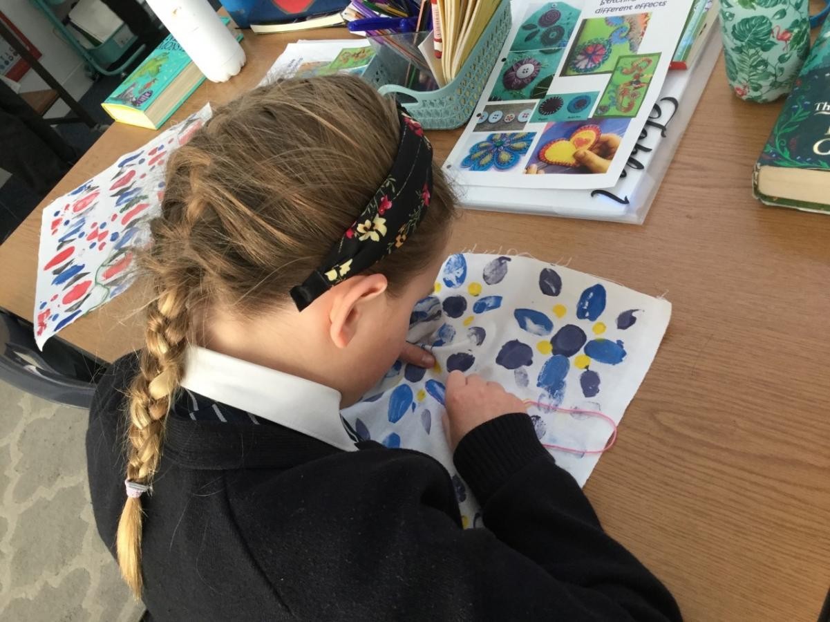 Textiles. Adding stitching and embellishments onto our fabric prints