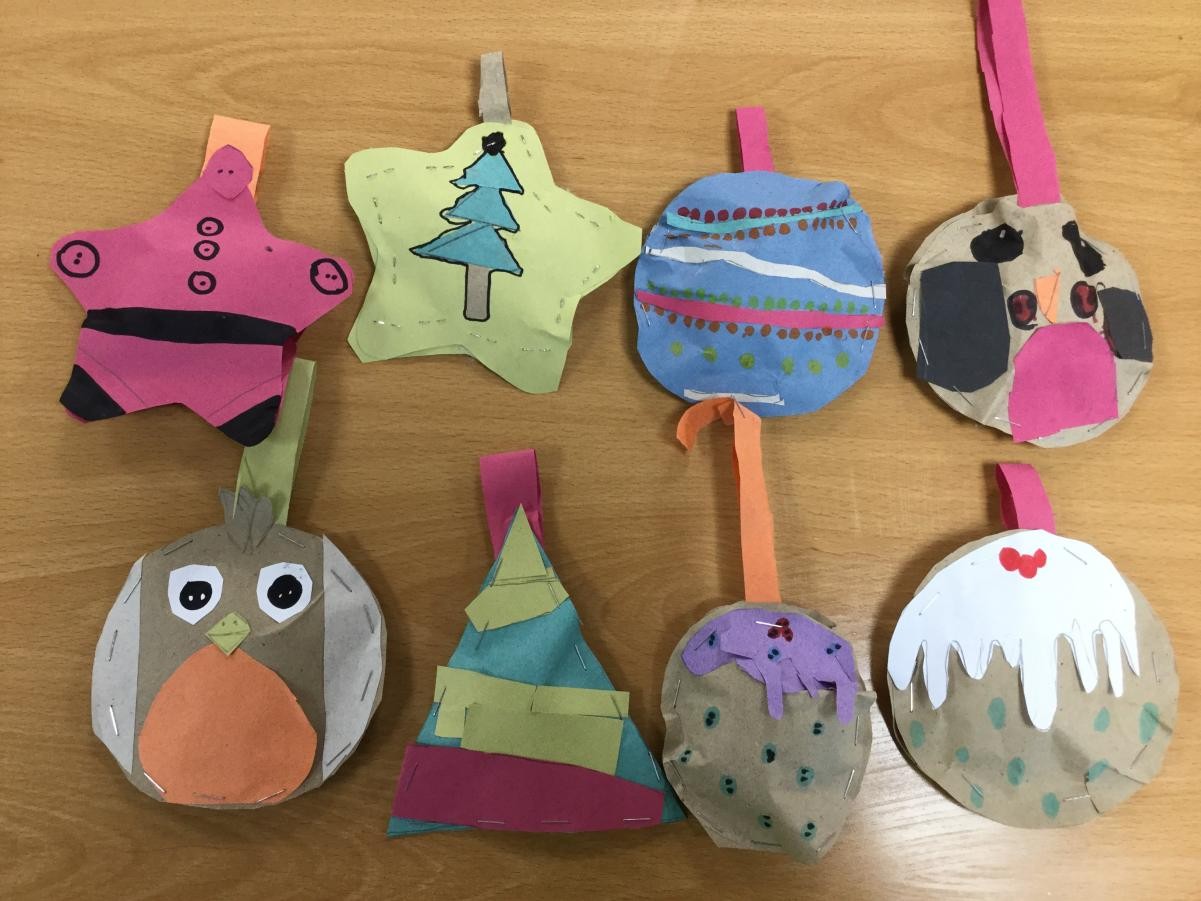 Designing and making Christmas decorations - paper mock ups.