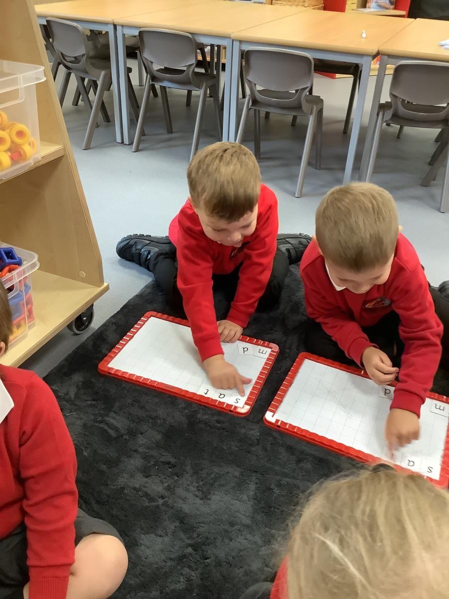 Phonics - using the magnetic boards to make words