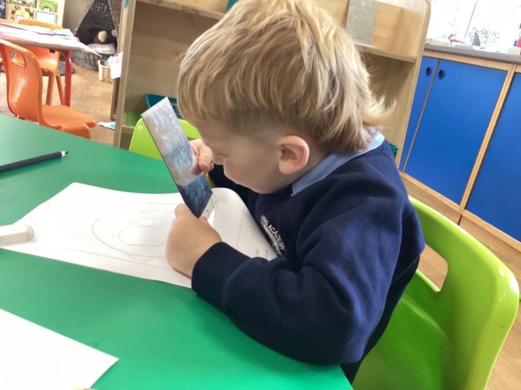 We have been using mirrors to help us draw our own self-portraits! 