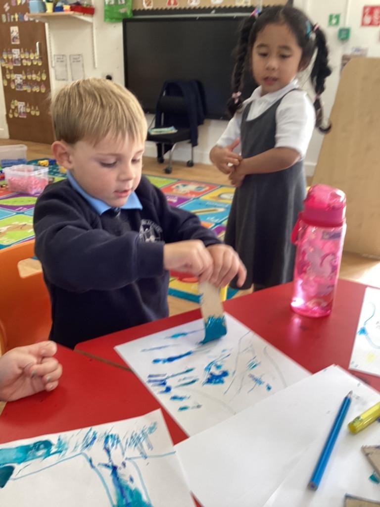 We explored using cardboard to make marks - we made our own big waves! 