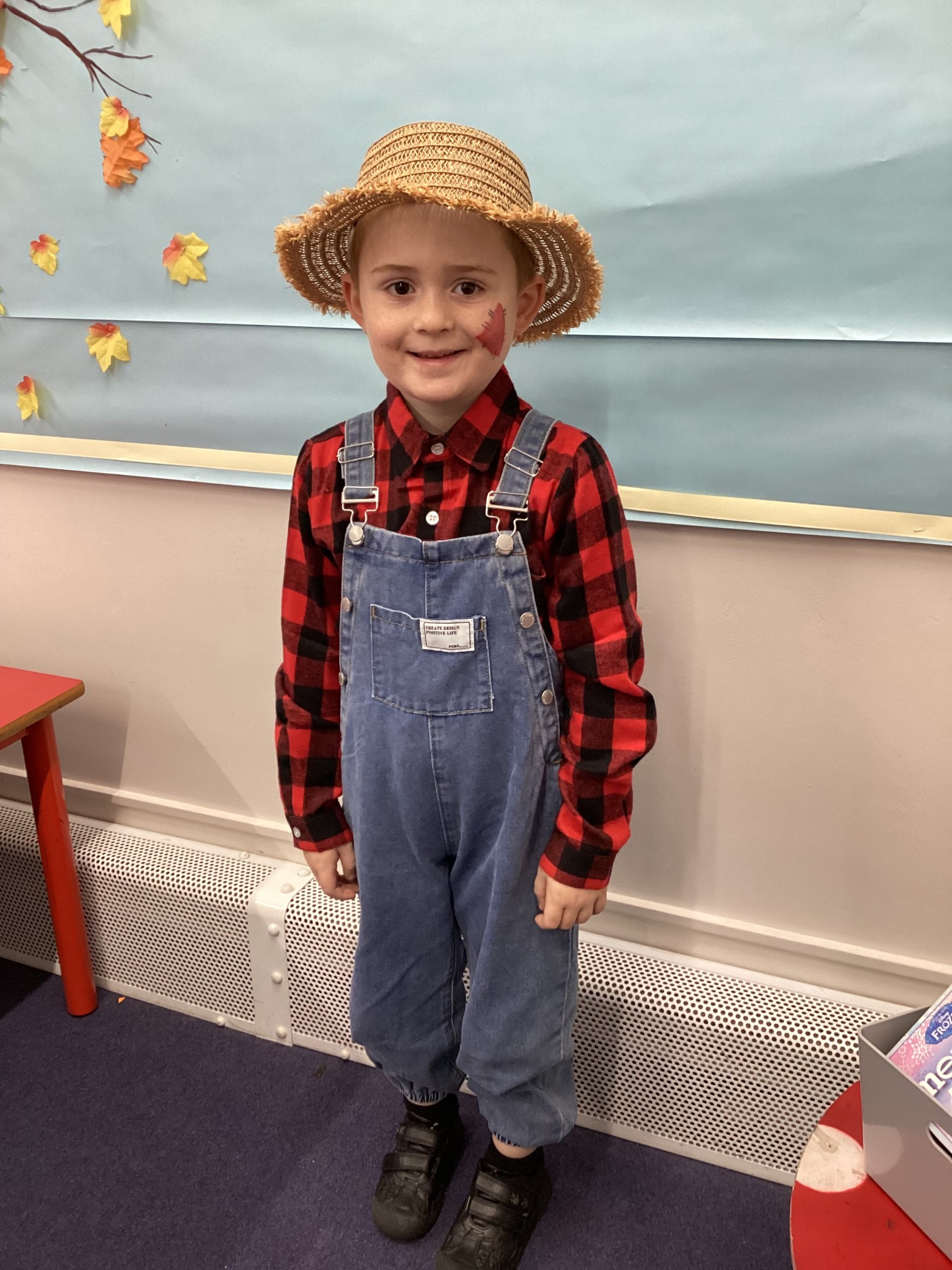 The children all dressed up as scarecrows for their Harvest Assembly.