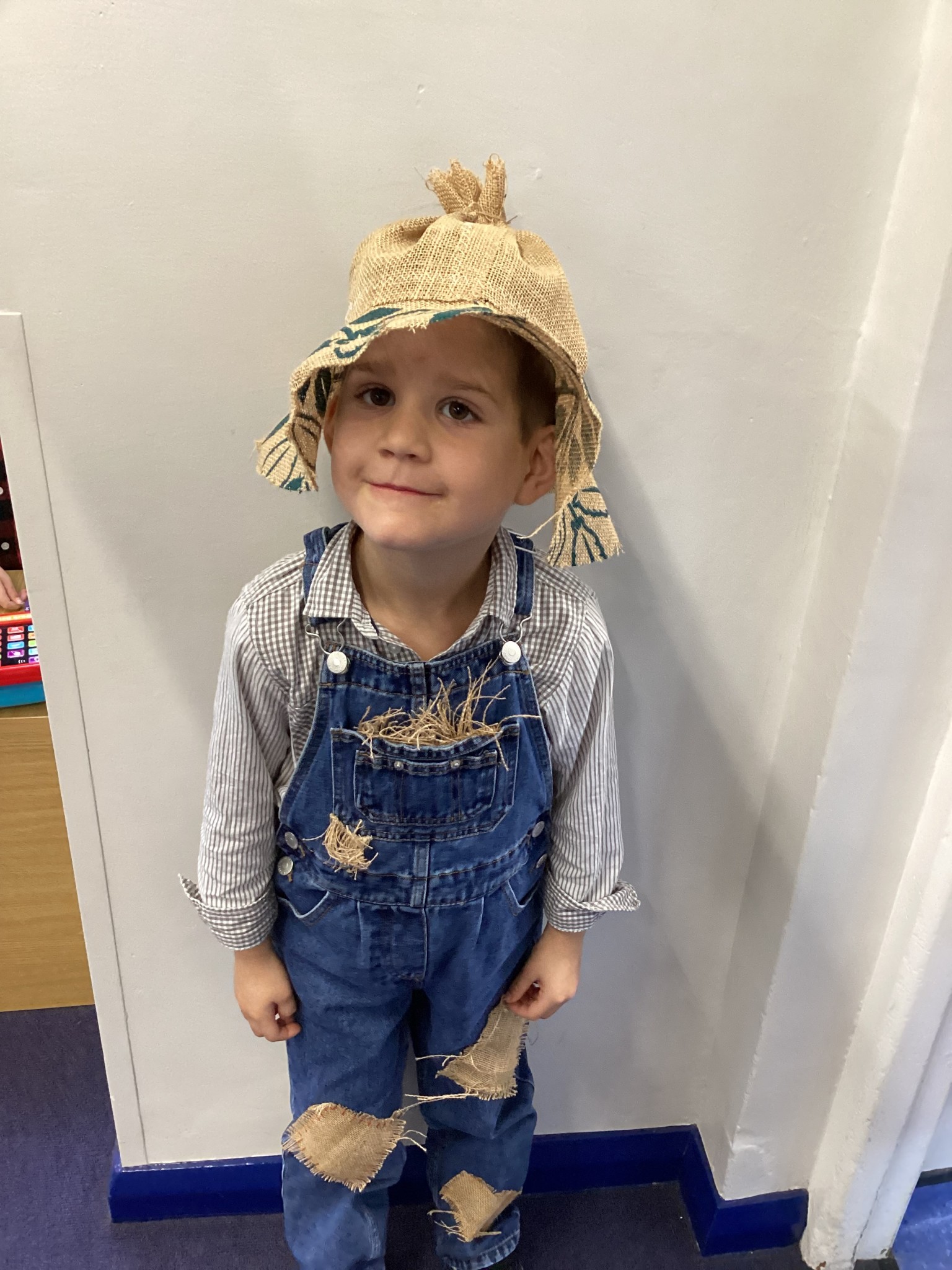 The children all dressed up as scarecrows for their Harvest Assembly.