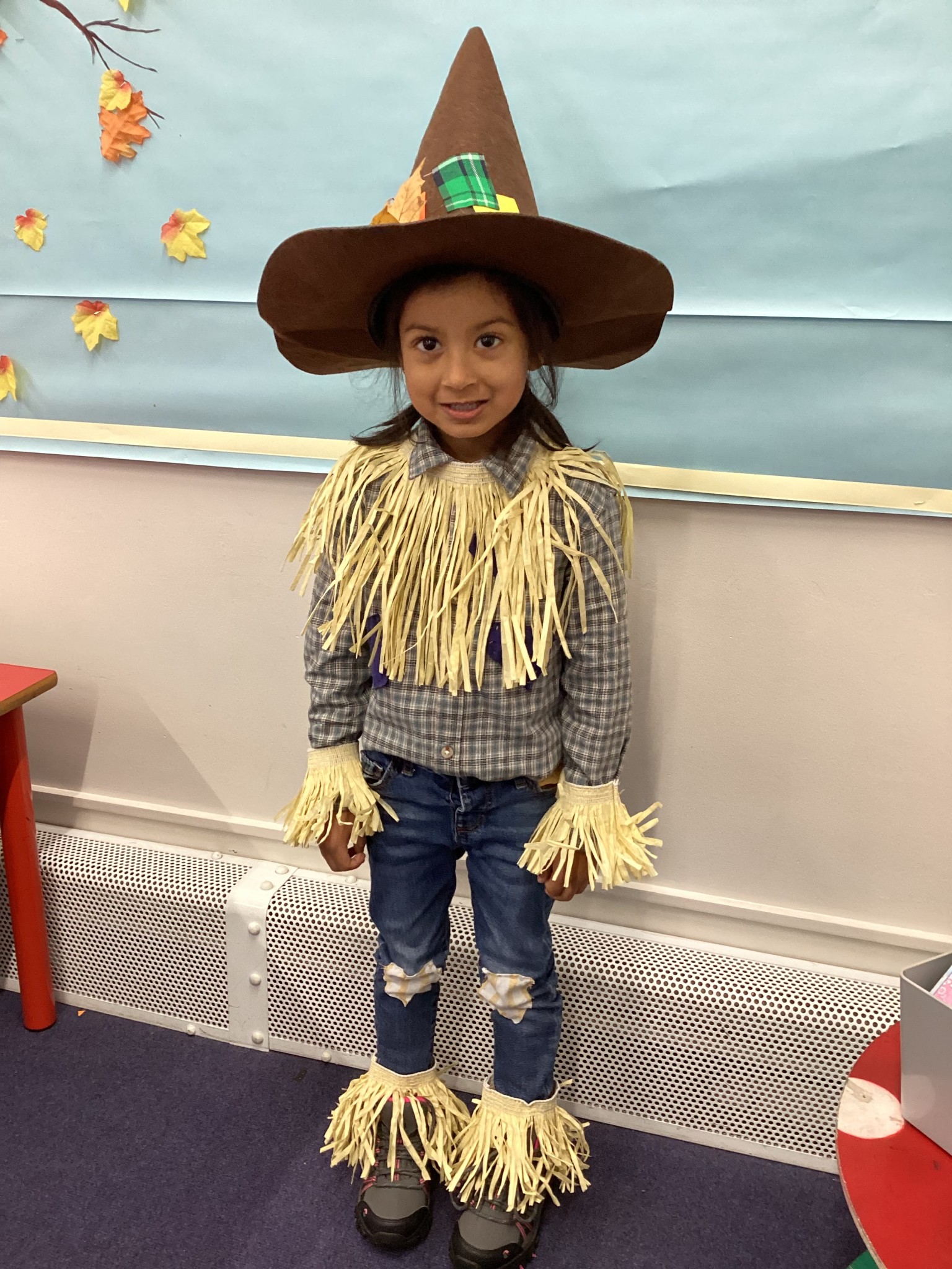 The children all dressed up as scarecrows for their Harvest Assembly.