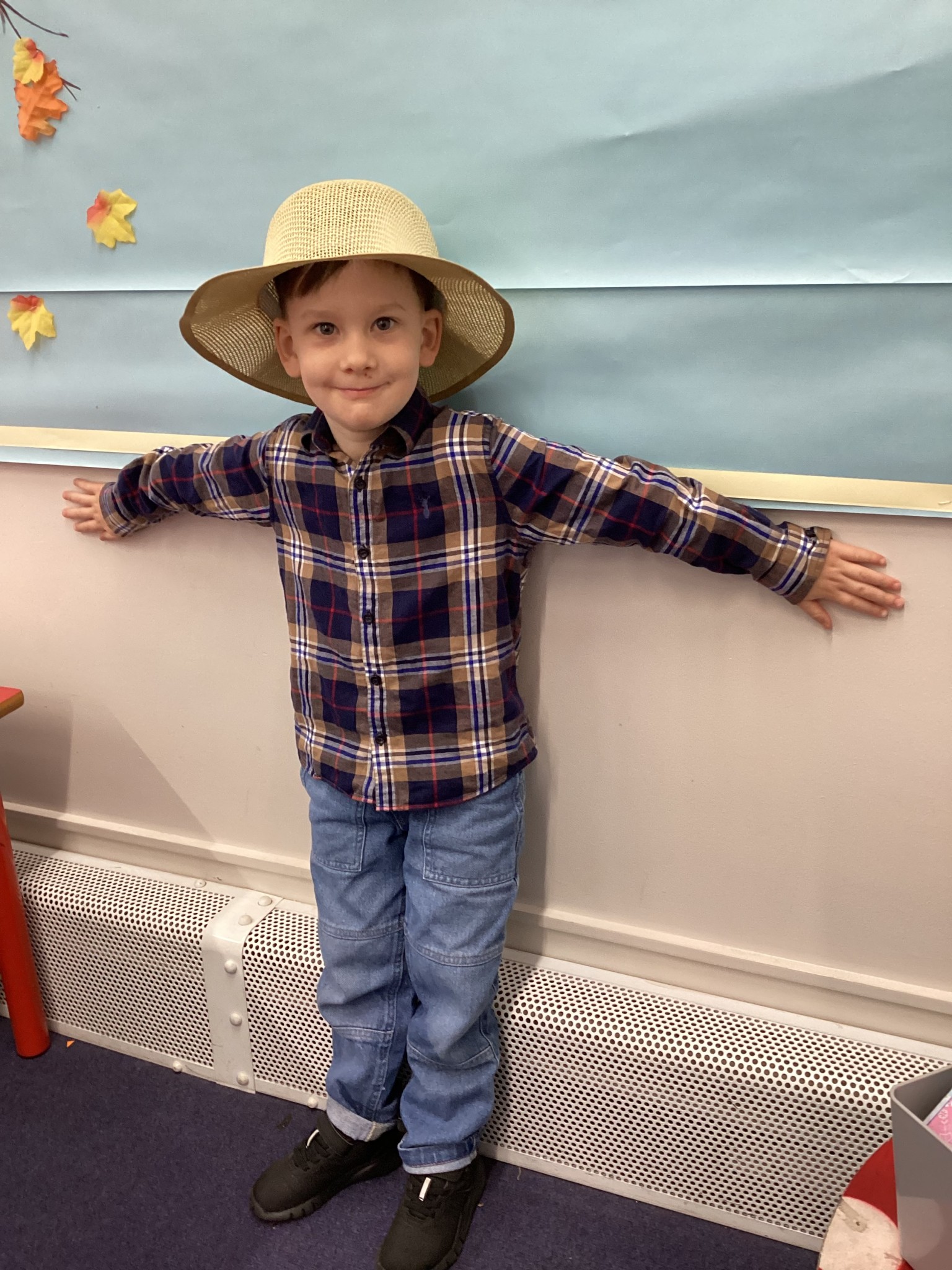The children all dressed up as scarecrows for their Harvest Assembly.