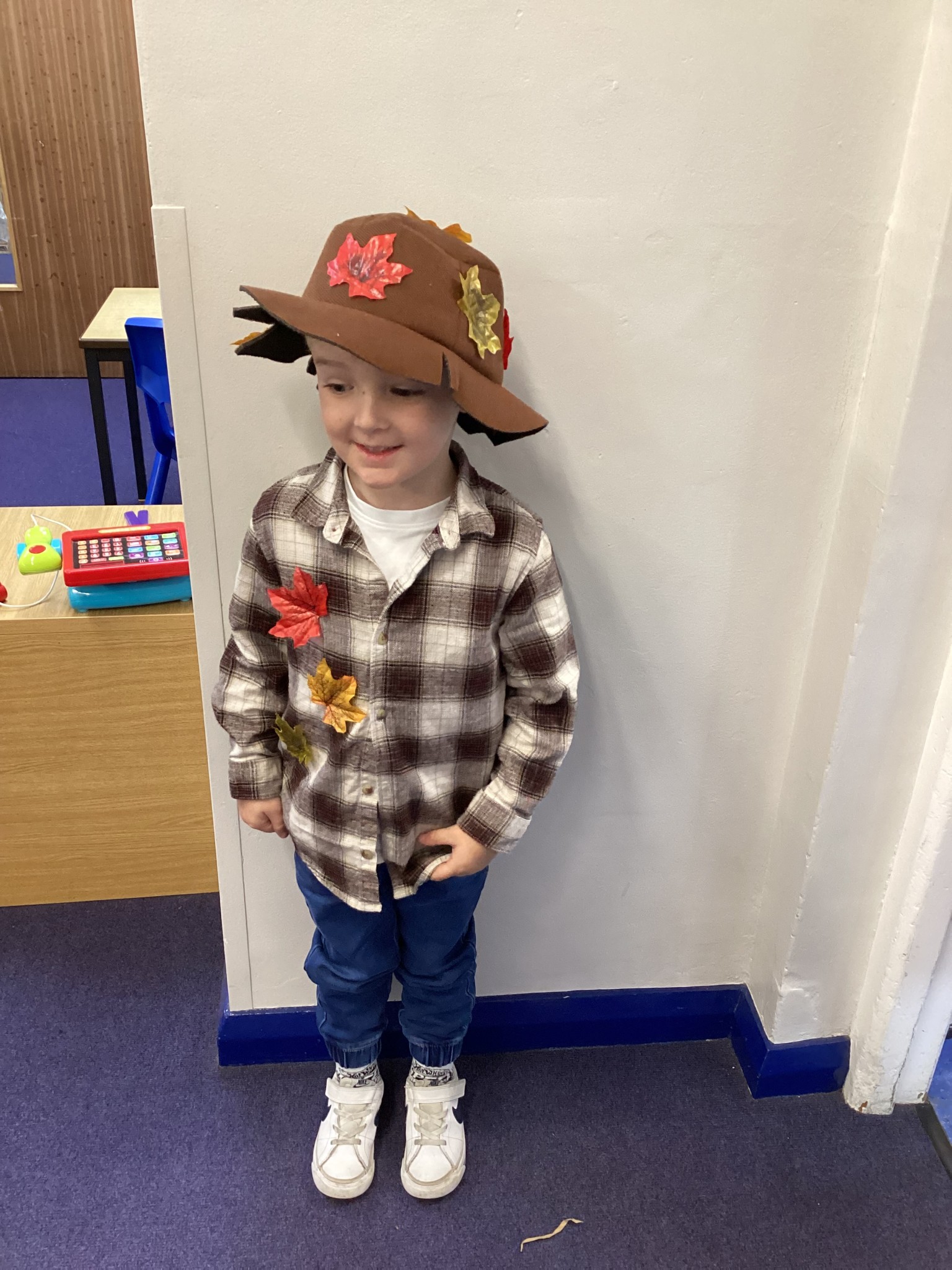 The children all dressed up as scarecrows for their Harvest Assembly.