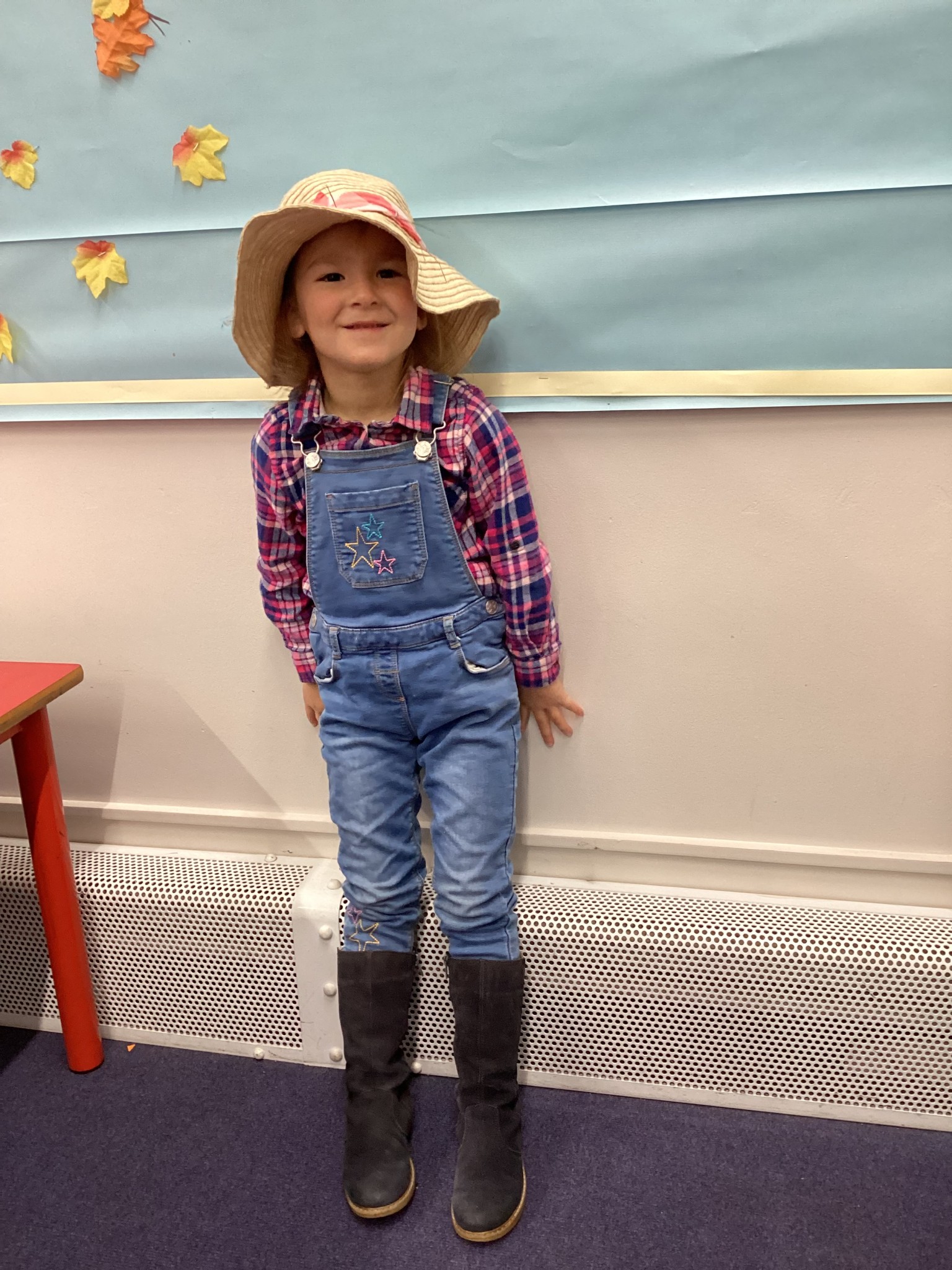 The children all dressed up as scarecrows for their Harvest Assembly.