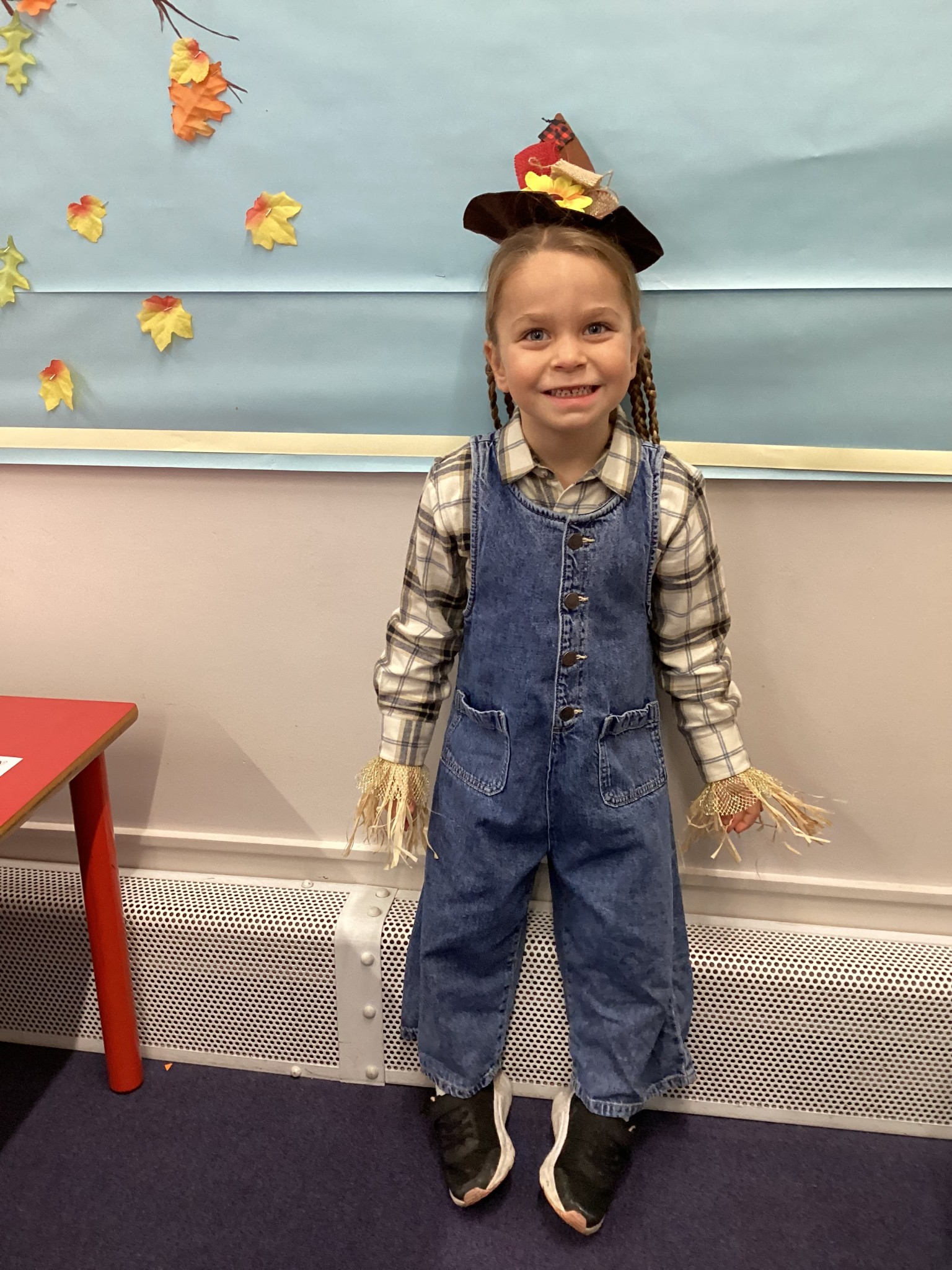 The children all dressed up as scarecrows for their Harvest Assembly.