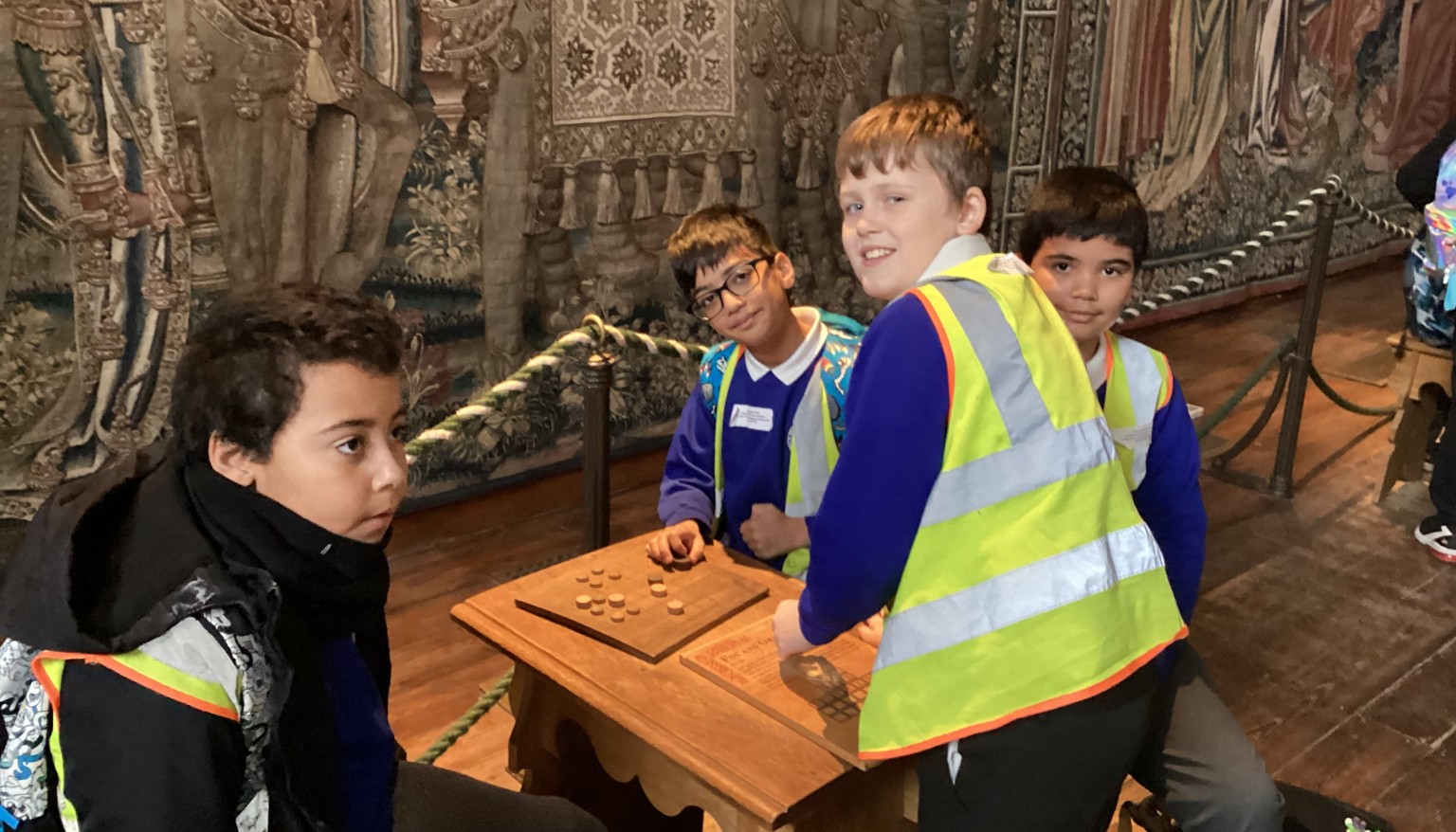 Playing a board game from the Tudor period.