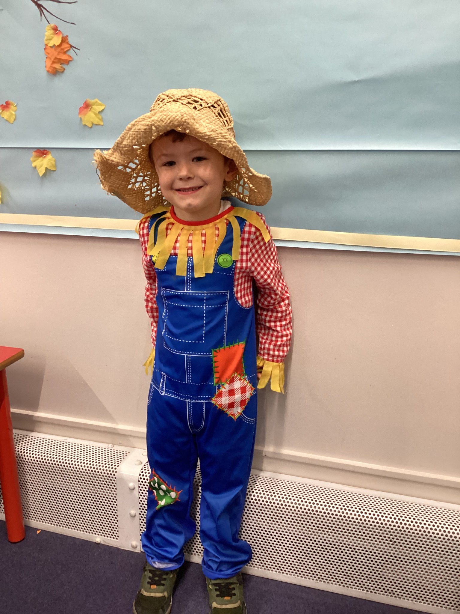 The children all dressed up as scarecrows for their Harvest Assembly.