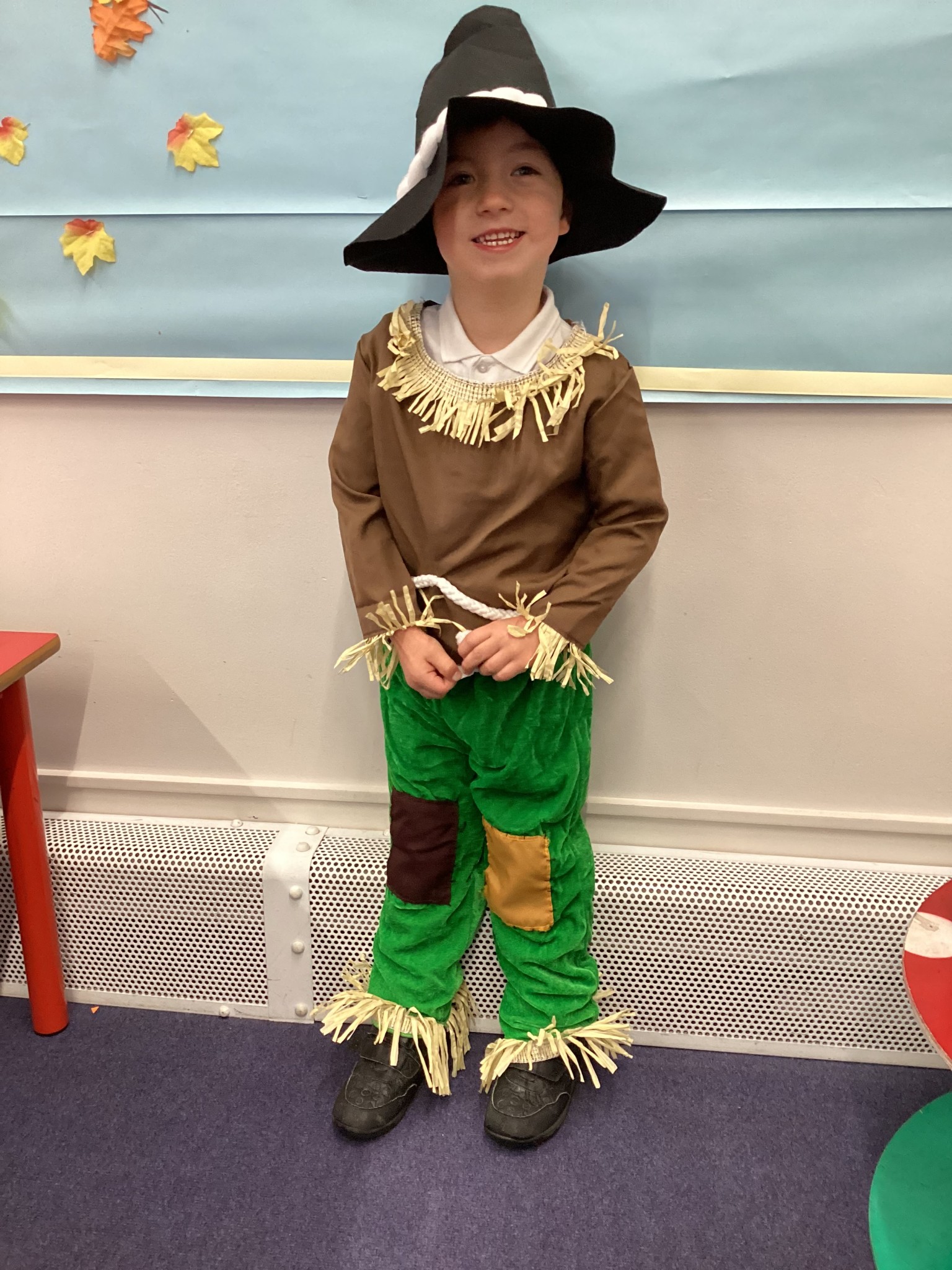 The children all dressed up as scarecrows for their Harvest Assembly.