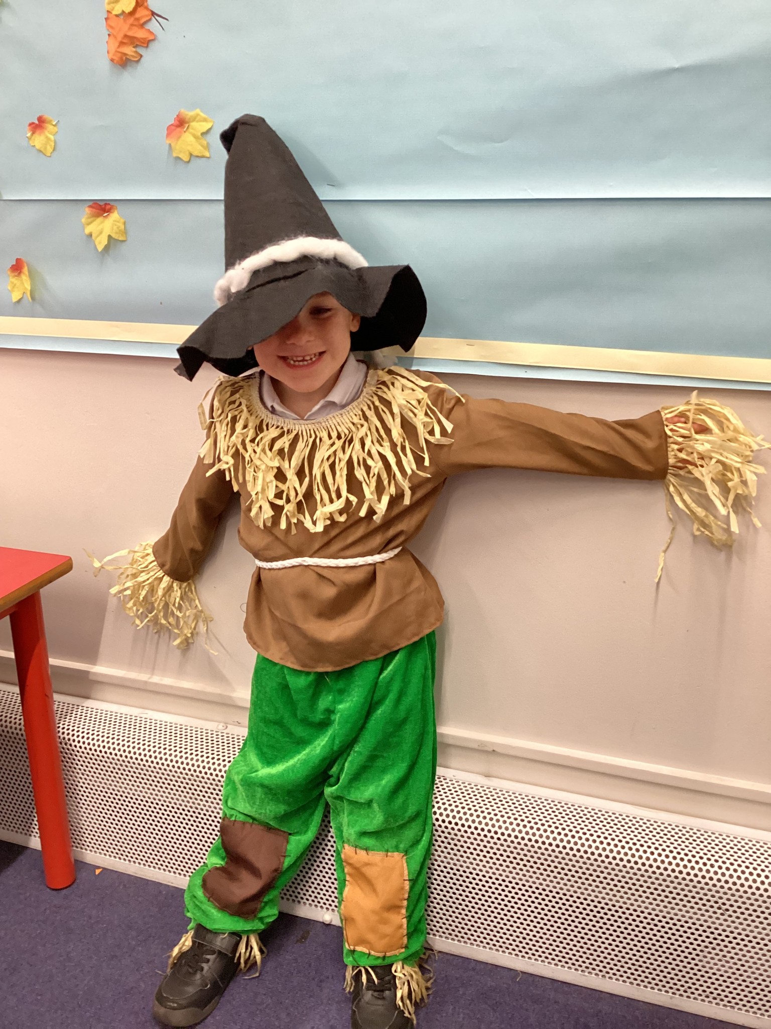 The children all dressed up as scarecrows for their Harvest Assembly.