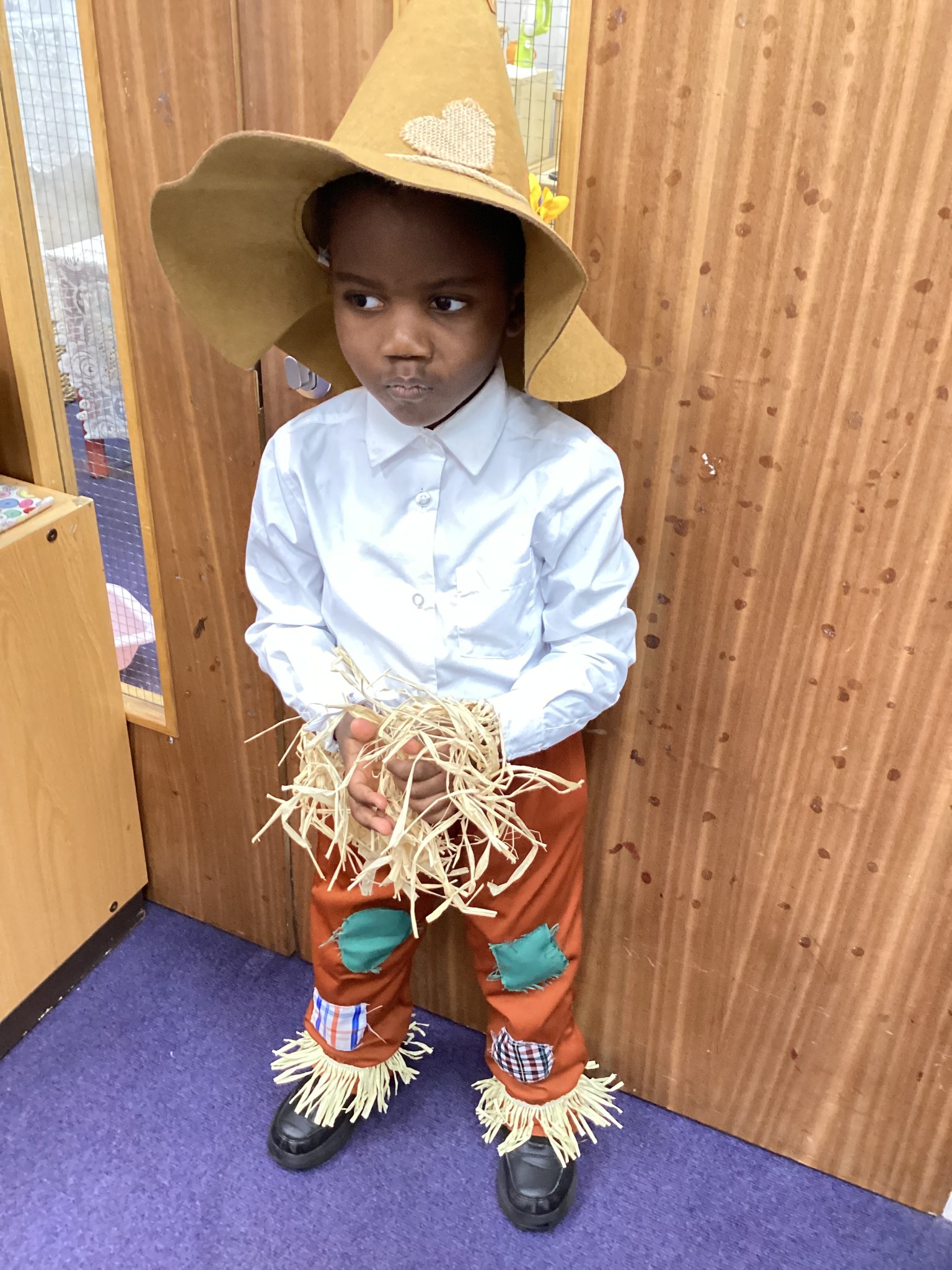 The children all dressed up as scarecrows for their Harvest Assembly.