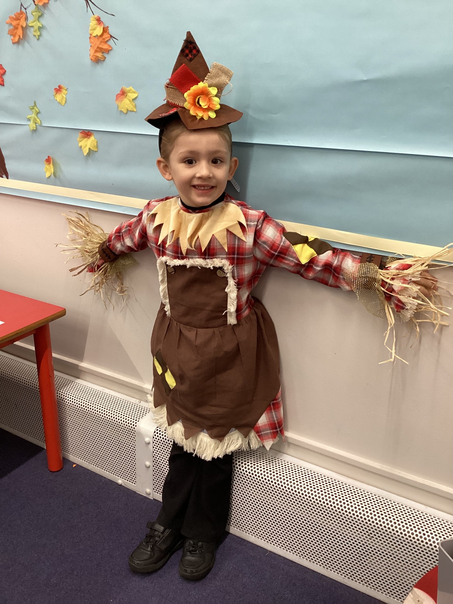 The children all dressed up as scarecrows for their Harvest Assembly.