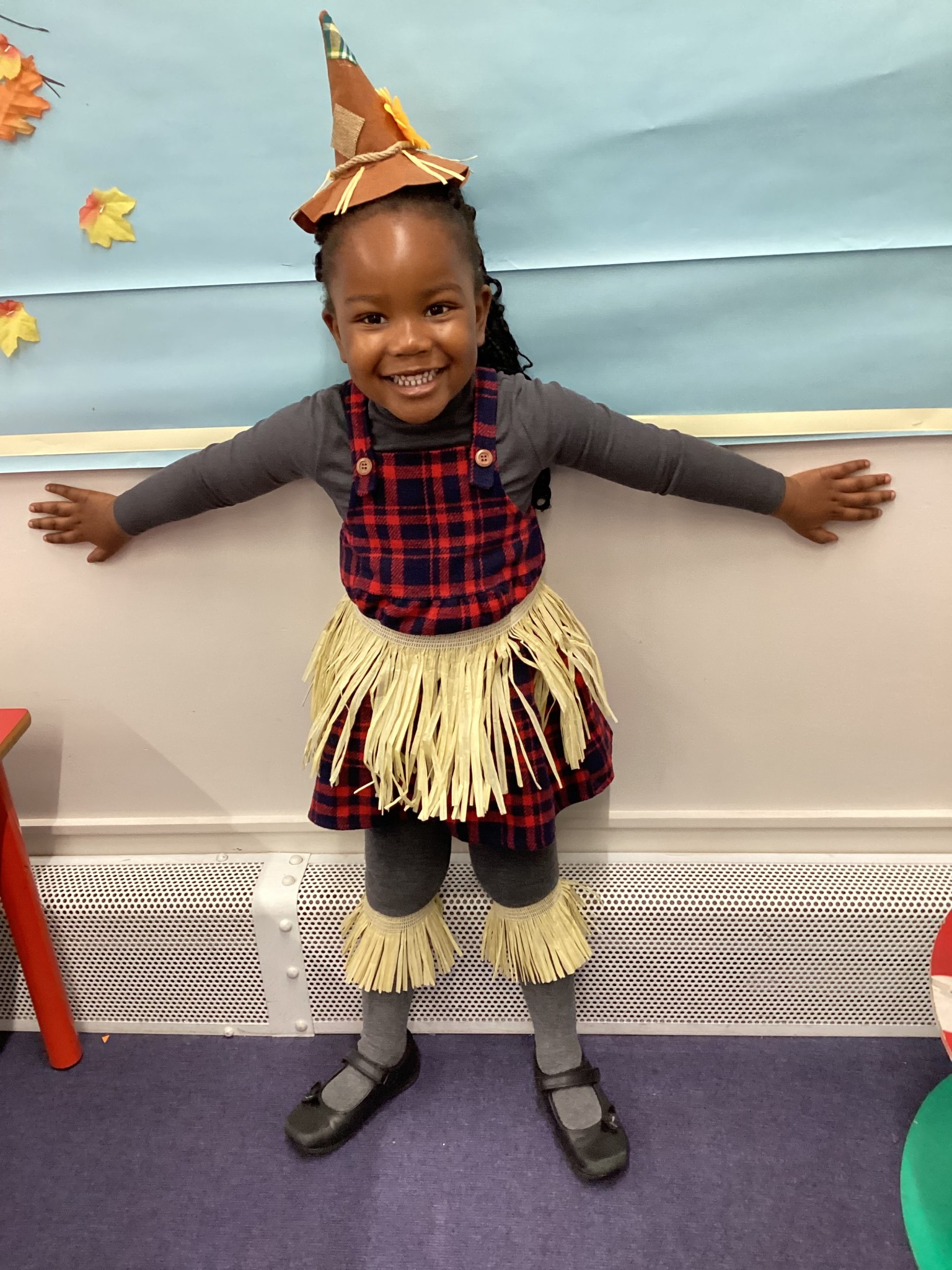The children all dressed up as scarecrows for their Harvest Assembly.