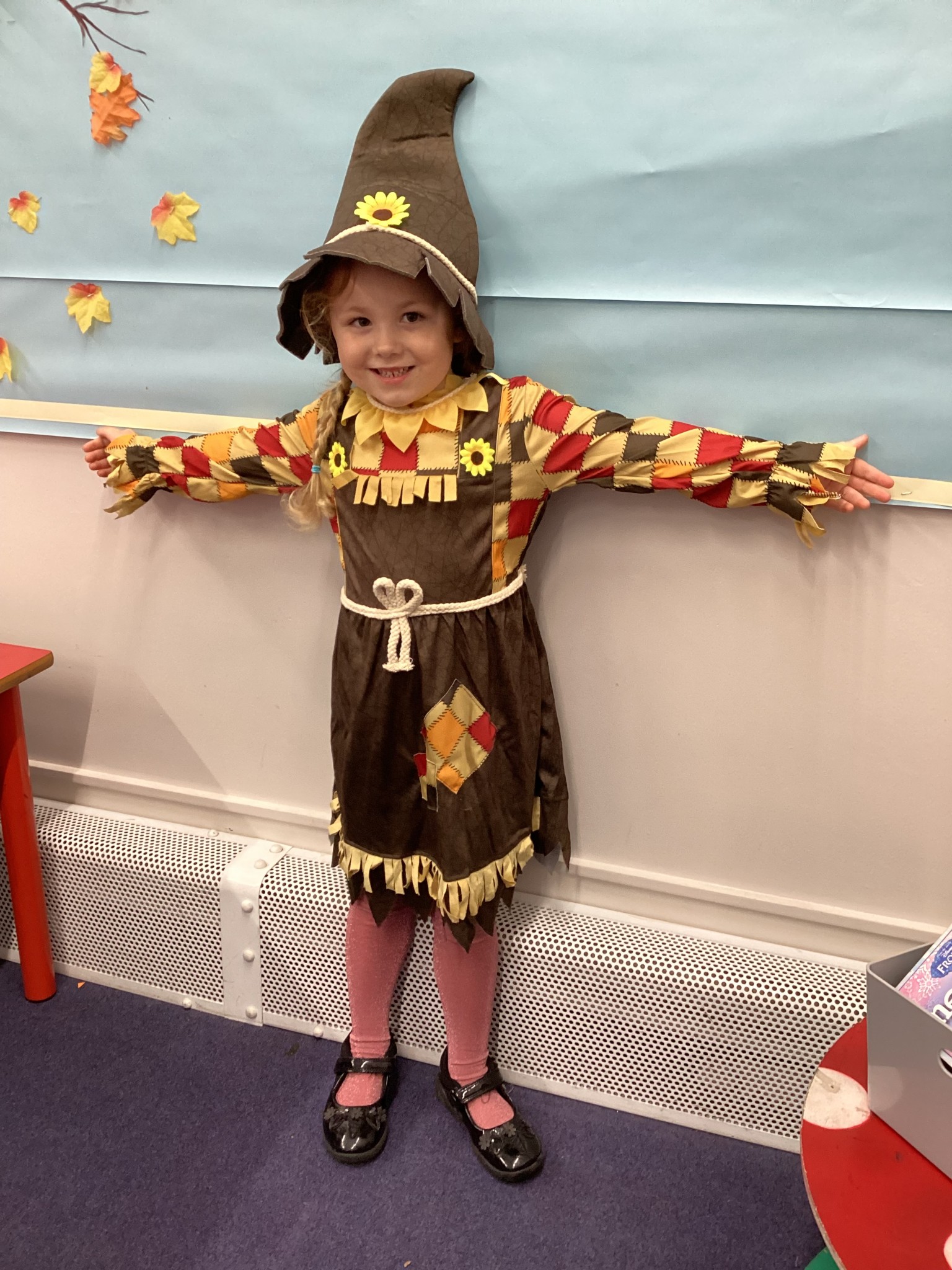 The children all dressed up as scarecrows for their Harvest Assembly.