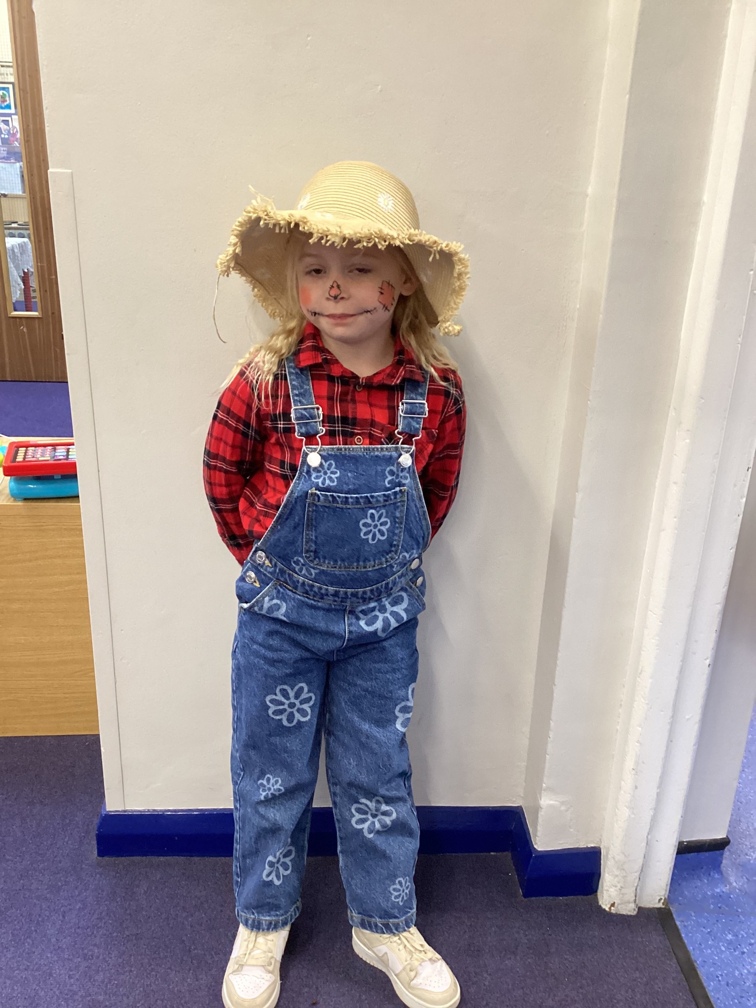 The children all dressed up as scarecrows for their Harvest Assembly.