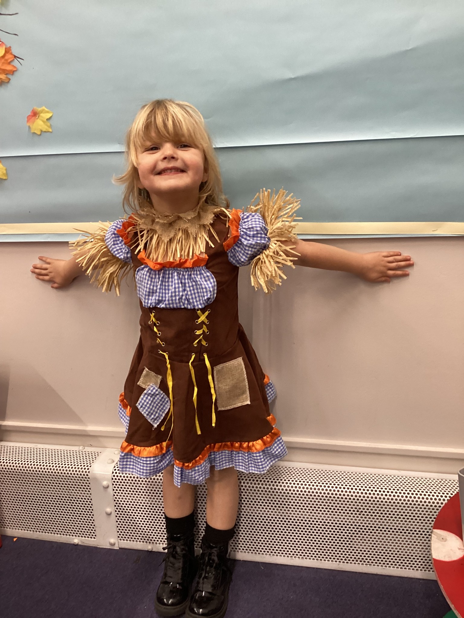 The children all dressed up as scarecrows for their Harvest Assembly.