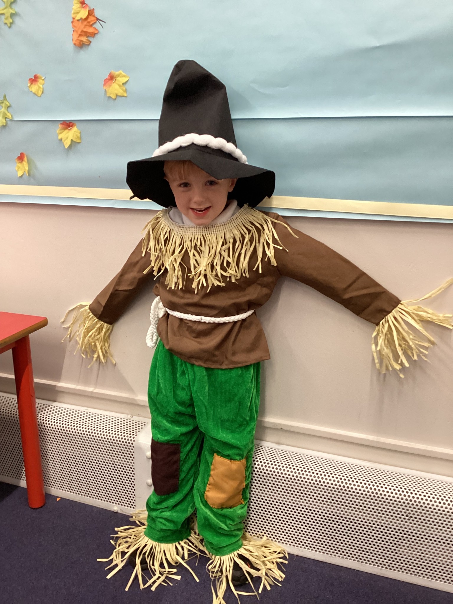 The children all dressed up as scarecrows for their Harvest Assembly.