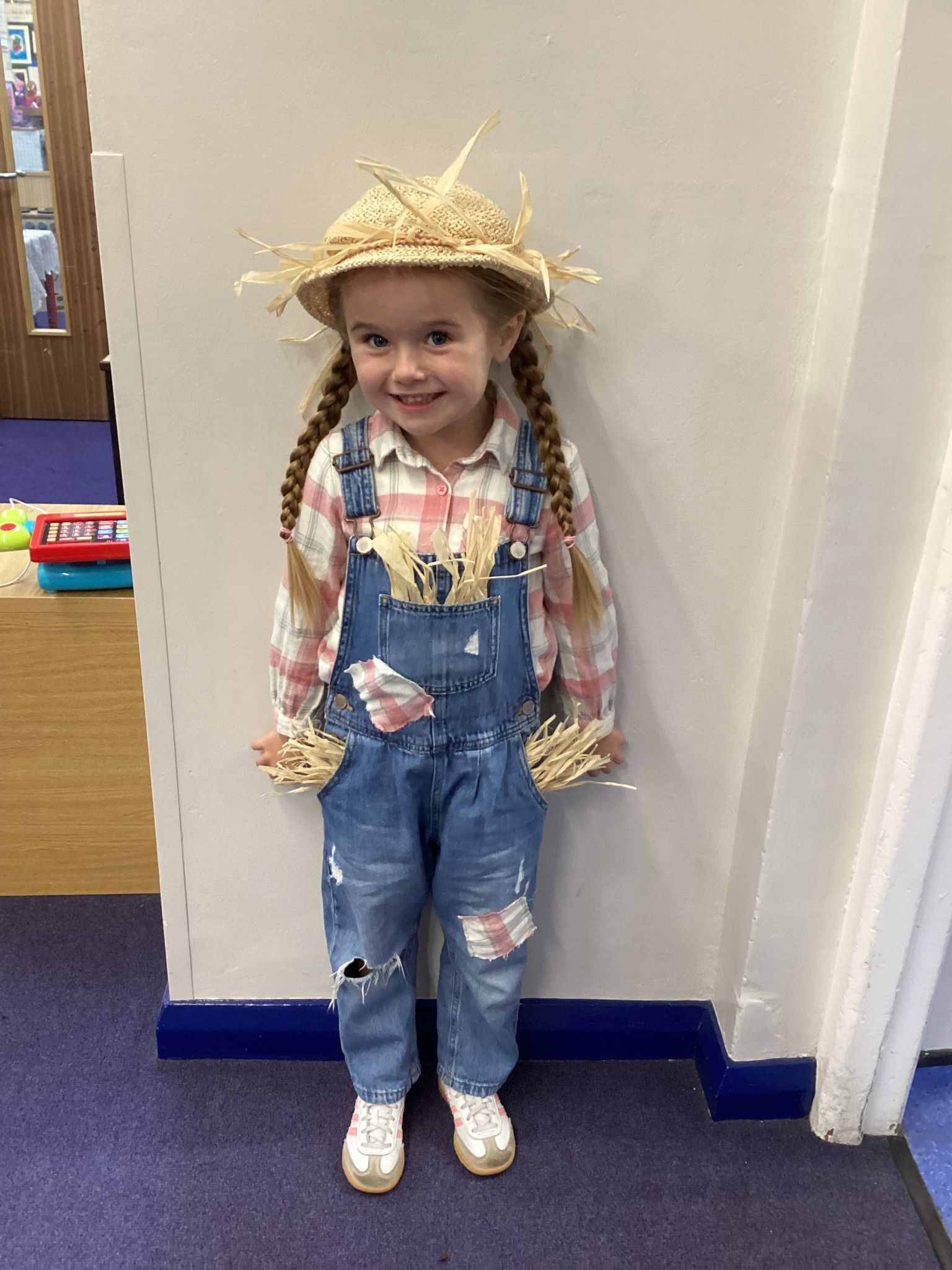 The children all dressed up as scarecrows for their Harvest Assembly.