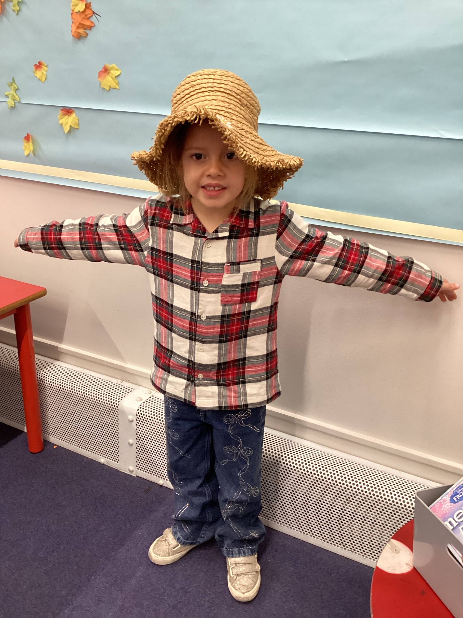 The children all dressed up as scarecrows for their Harvest Assembly.