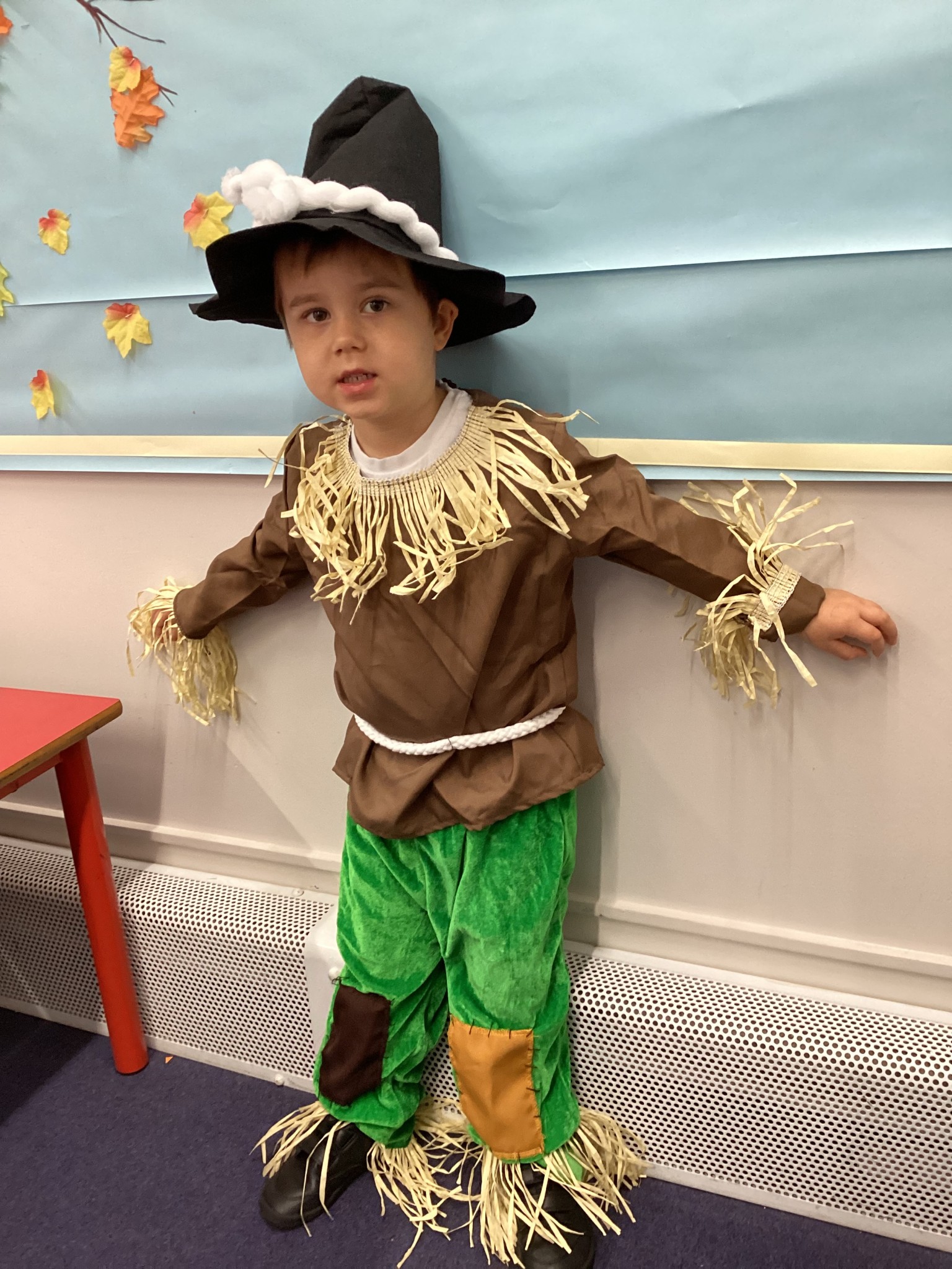 The children all dressed up as scarecrows for their Harvest Assembly.