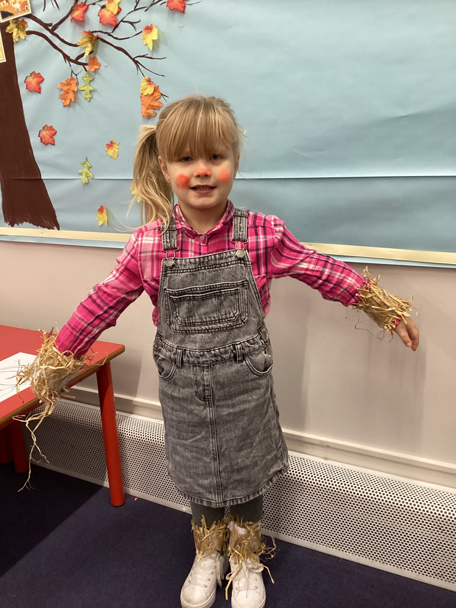 The children all dressed up as scarecrows for their Harvest Assembly.