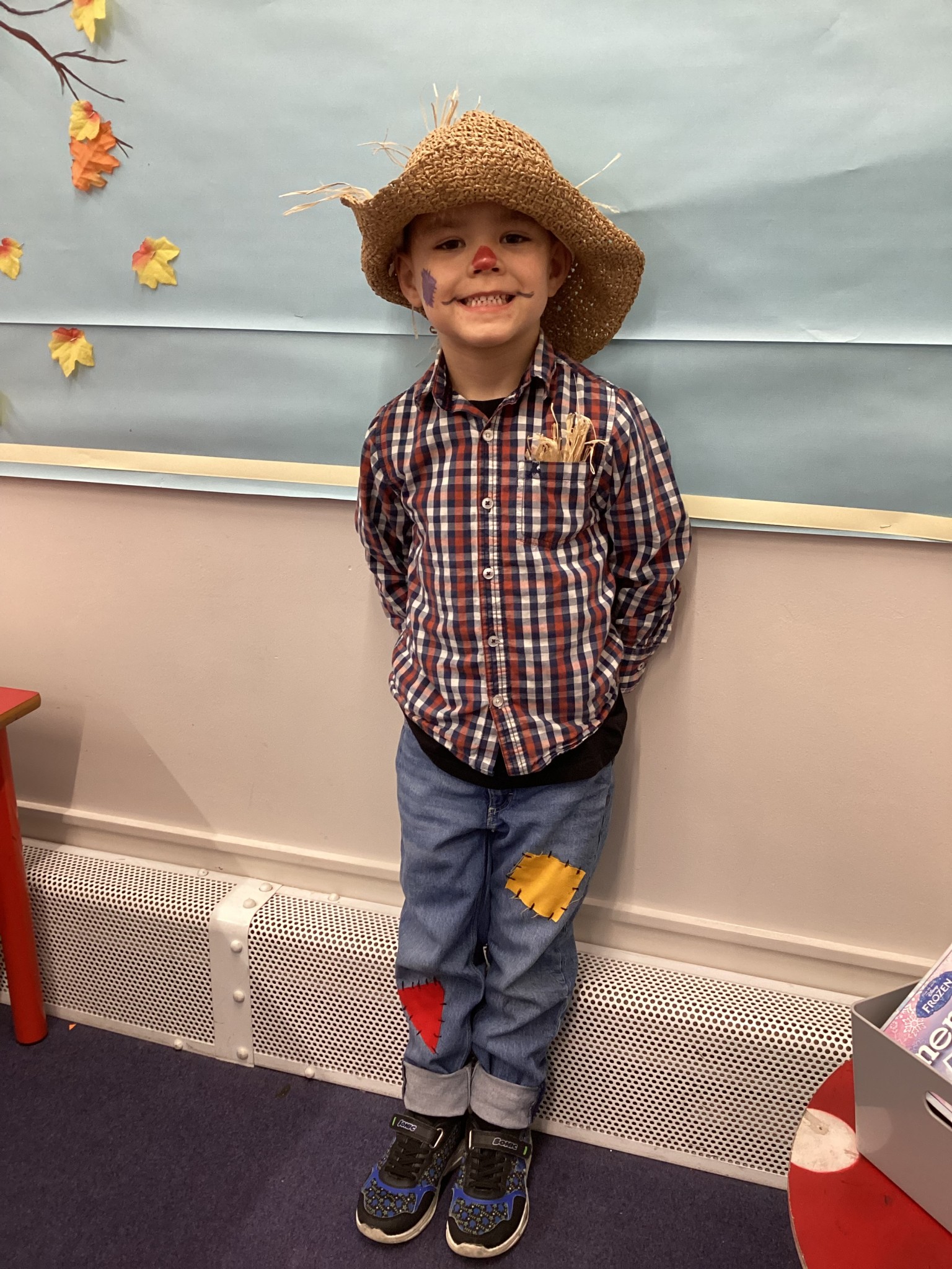 The children all dressed up as scarecrows for their Harvest Assembly.
