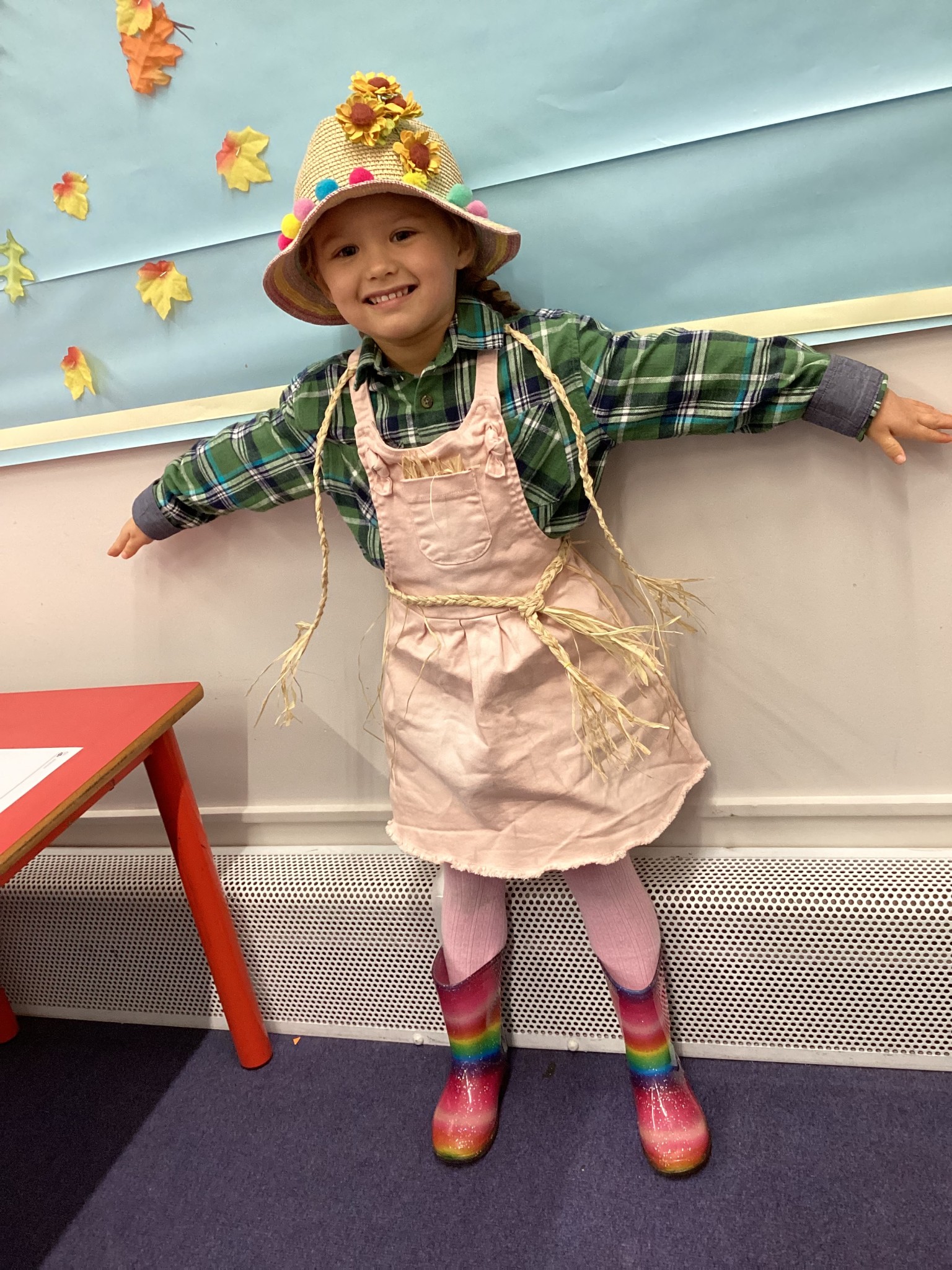 The children all dressed up as scarecrows for their Harvest Assembly.