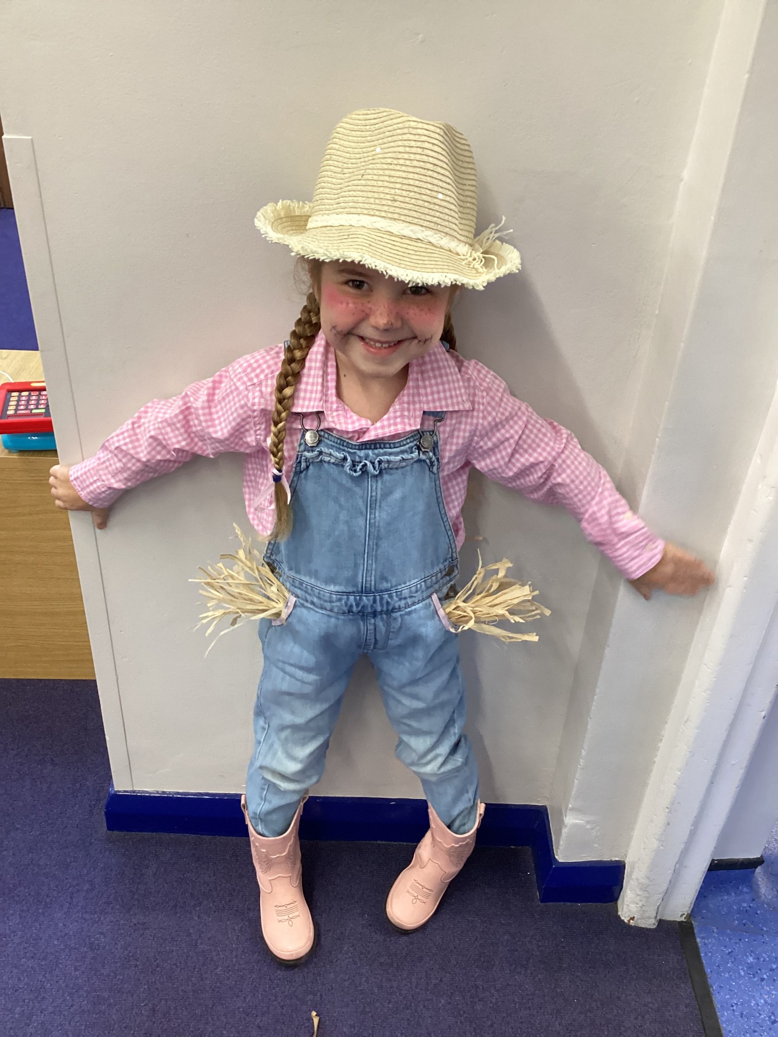 The children all dressed up as scarecrows for their Harvest Assembly.