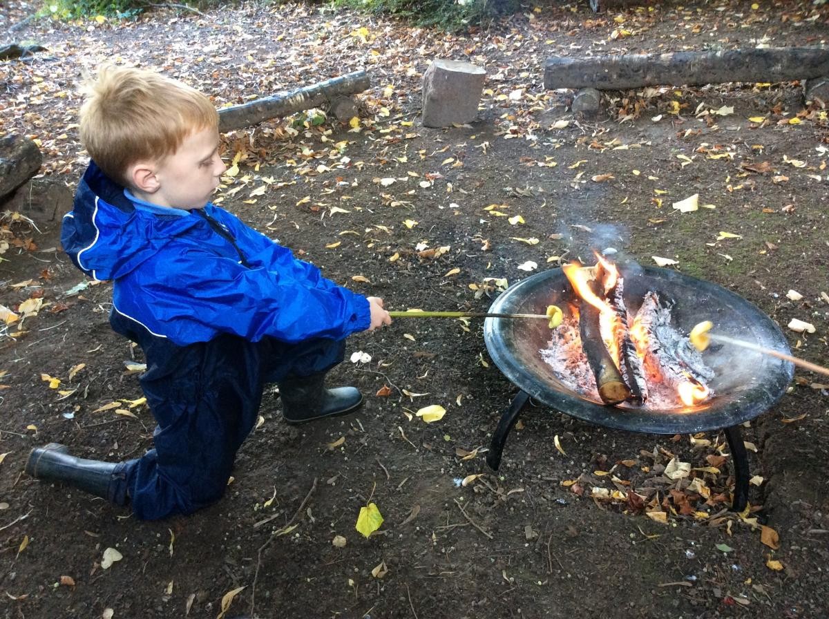 We cooked the apple over the fire, then dipped it into some cinnamon brown sugar and held it over the fire again until the sugar melted.