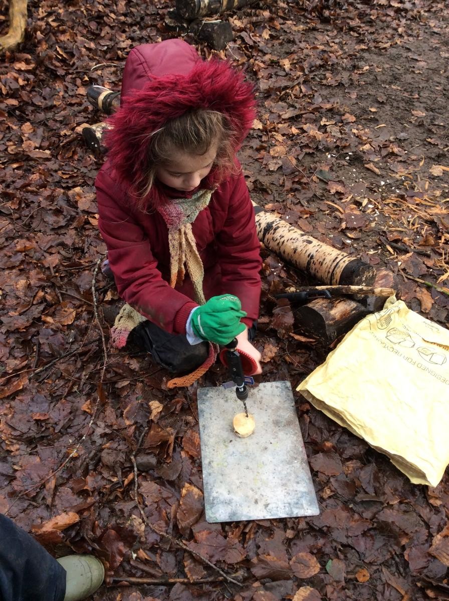 Some of us then used the hand drill to make a hole in our wood cookie.