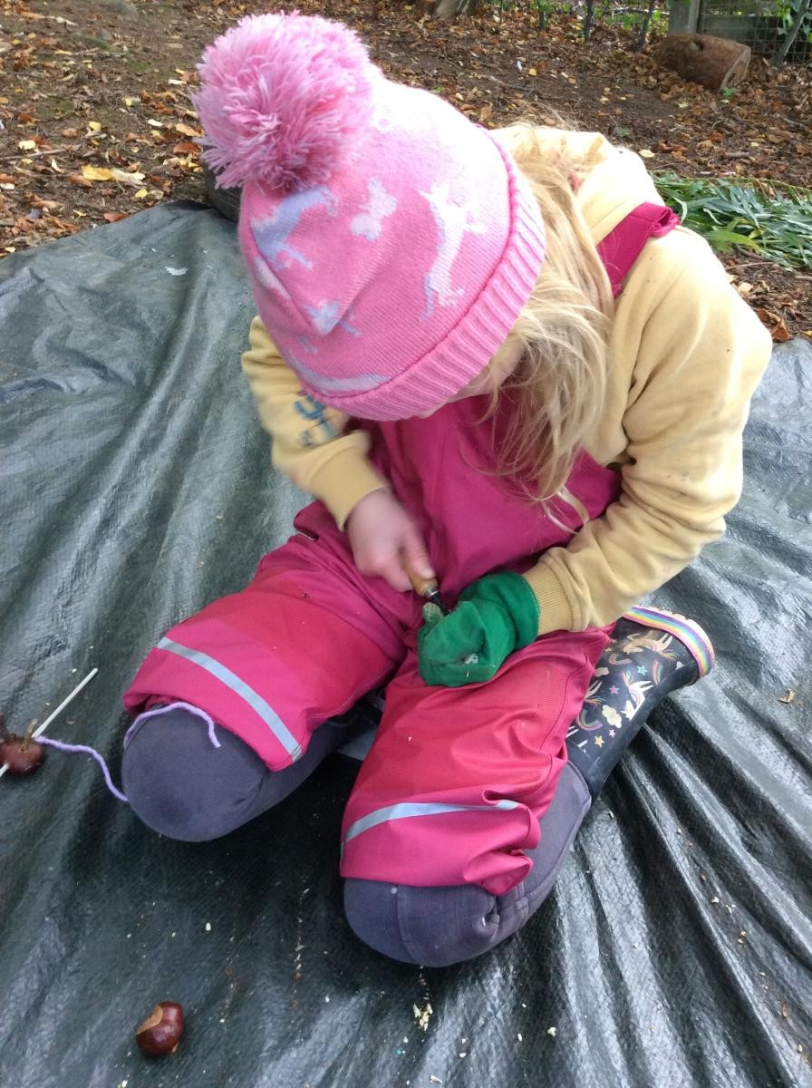We used palm drills to make a hole through the conkers.