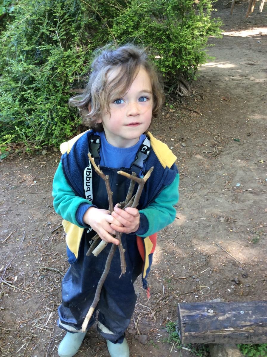 Reception Class learned the three things that a fire needs: fuel, heat and oxygen. We collected sticks for the fire.