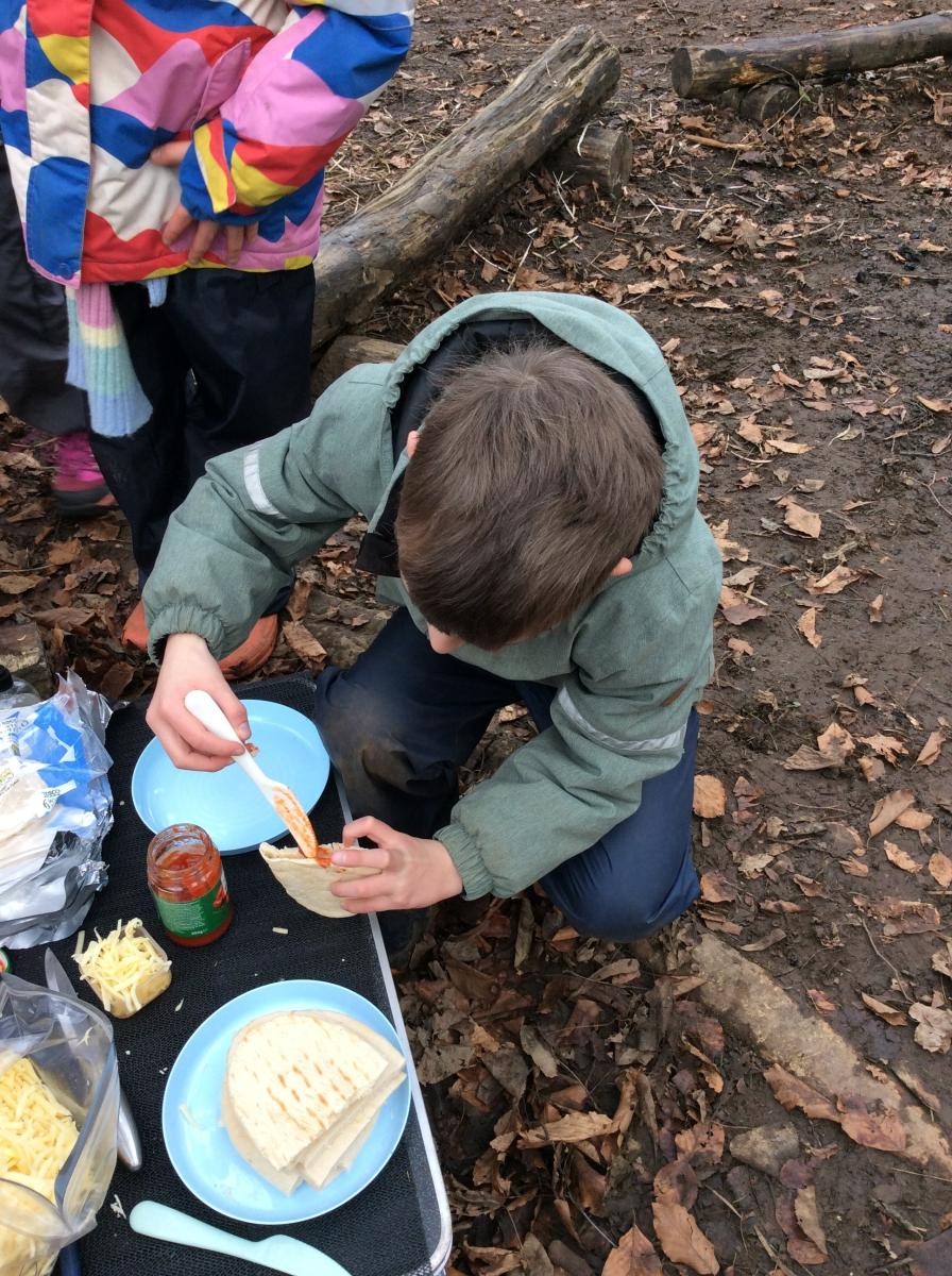 We filled pitta bread with tomato pizza topping and cheese.