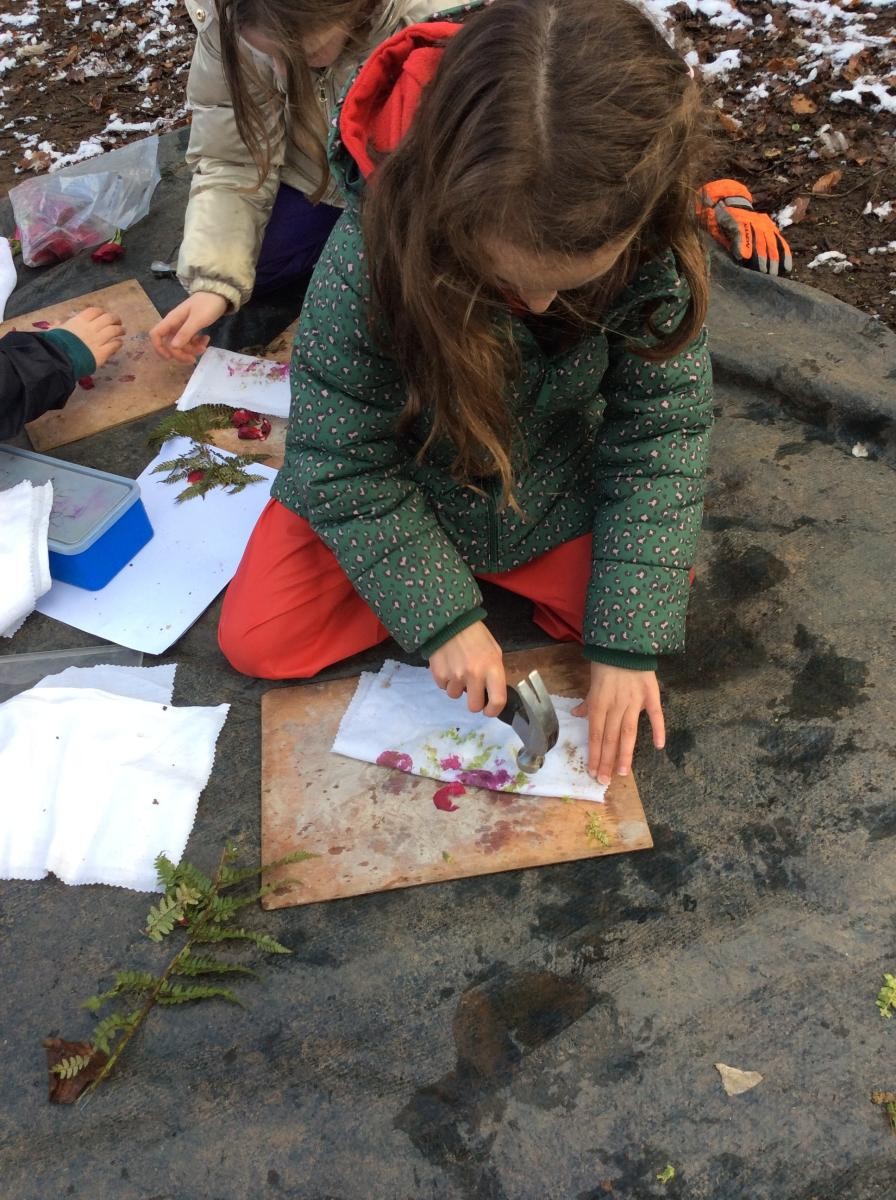 We put rose petals and fern leaves in between fabric and hit them with a hammer.