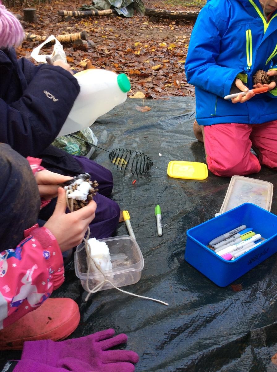 We made some pine cone feeders.