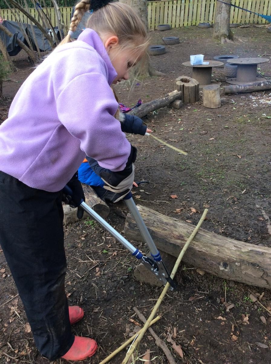 We learned to use the loppers to cut lengths of willow.