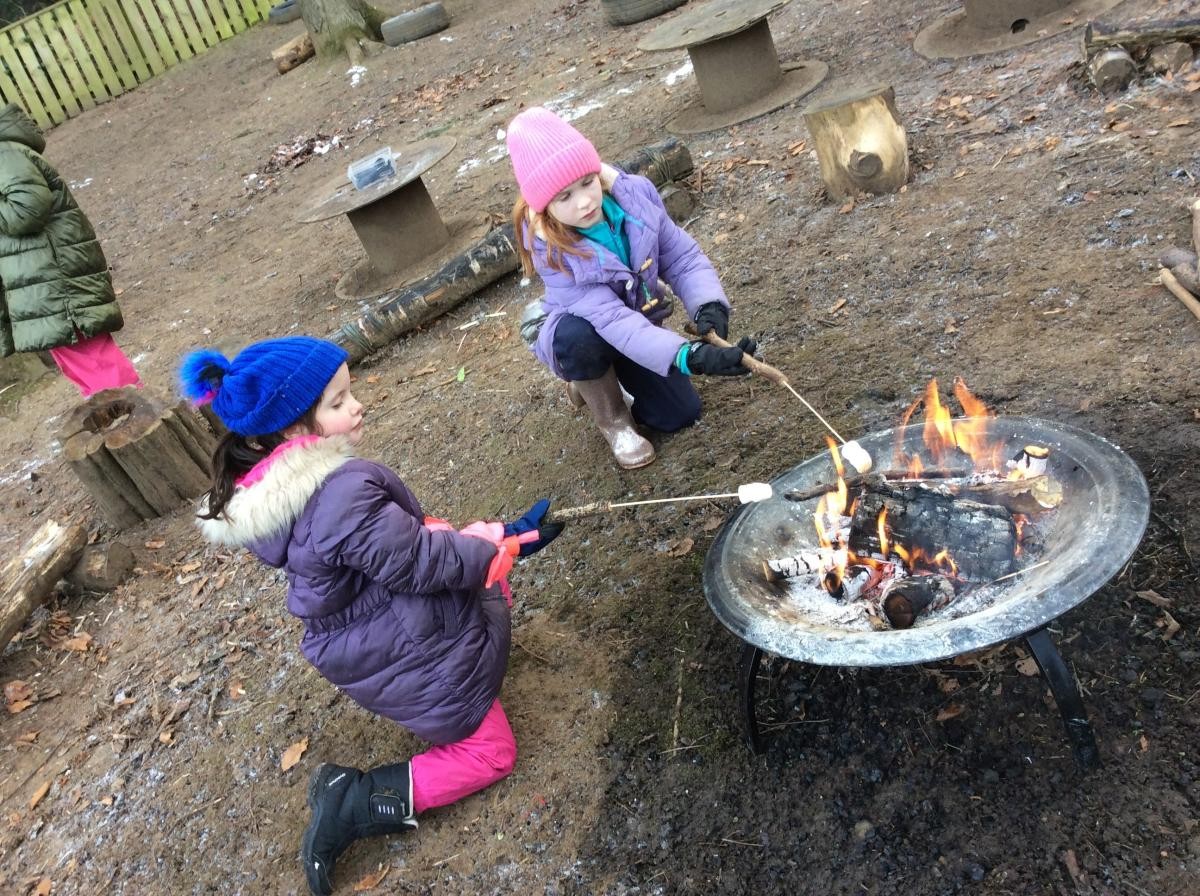 Years 3 and 4 kept warm by the fire and toasted marshmallows.