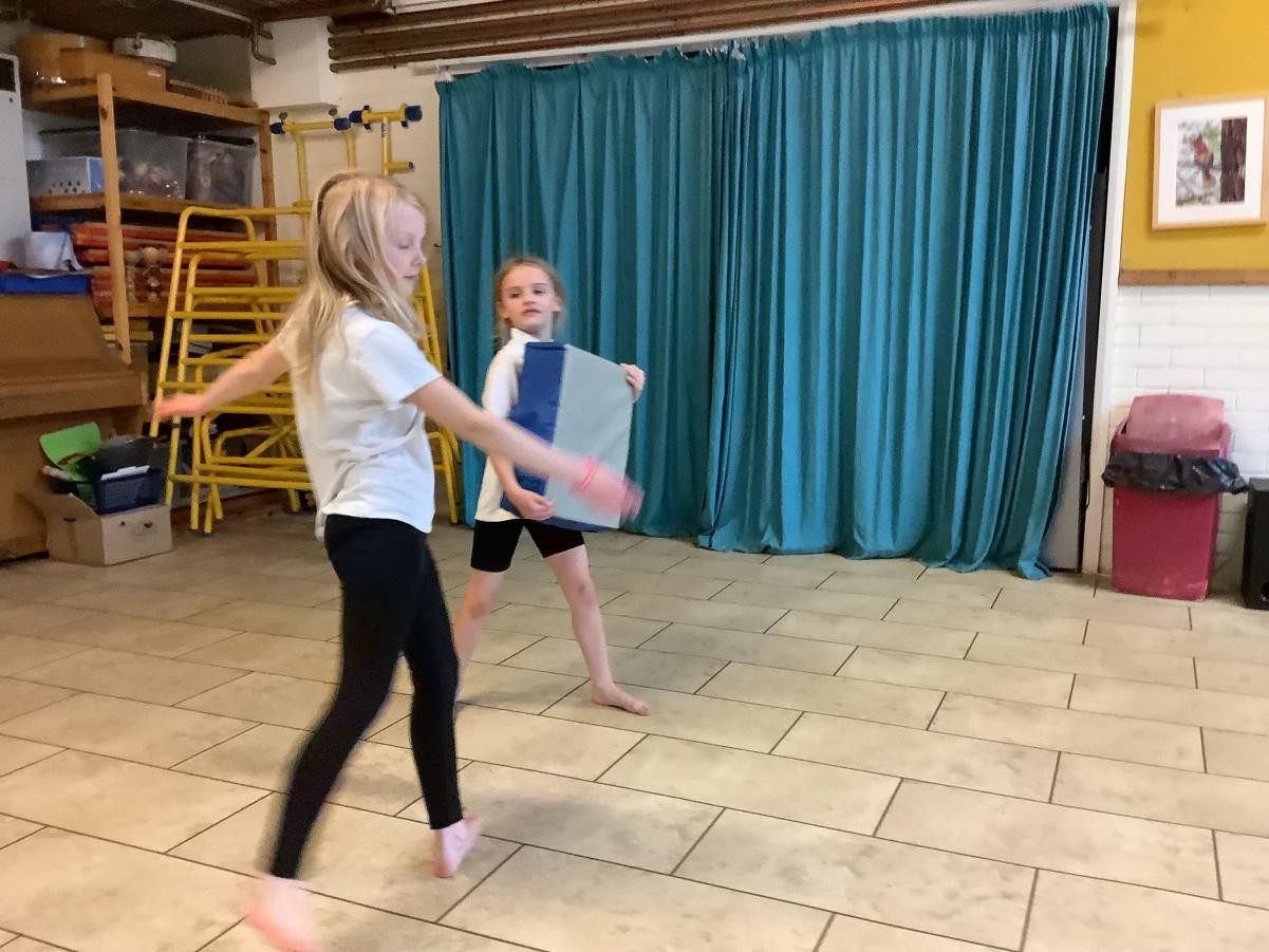 Using a pad to kick.