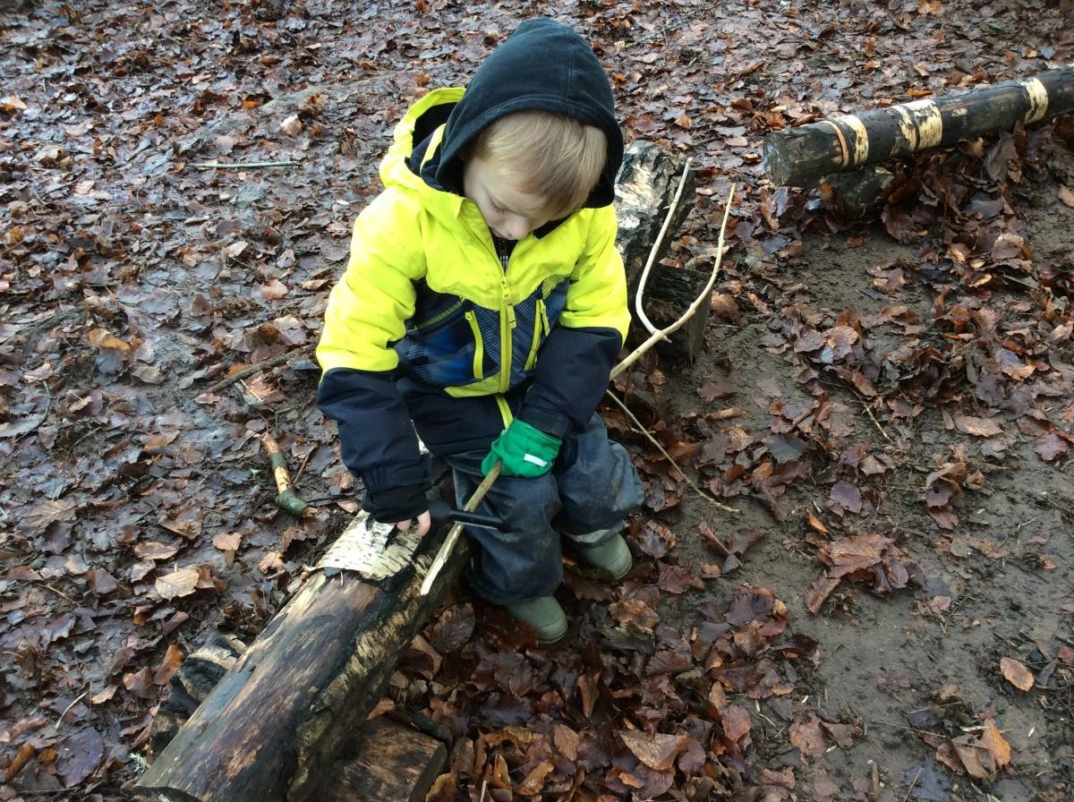 We used the peeler to peel off some bark, then we used colouring pens to draw a face on our stick person.