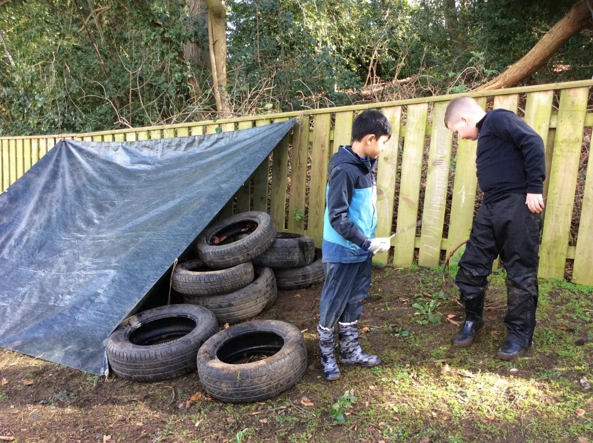 We made a den with a tarpaulin and tyres.