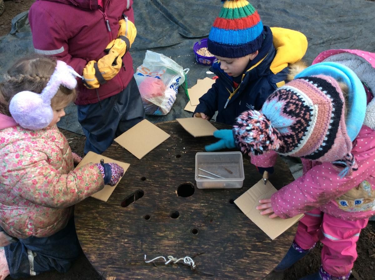 We used the palm drills to make hole in a piece of cardboard.