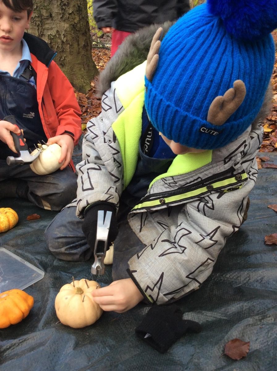 Hammering nails in is a fiddly job and it is easier to get the nails into pumpkins than wood!