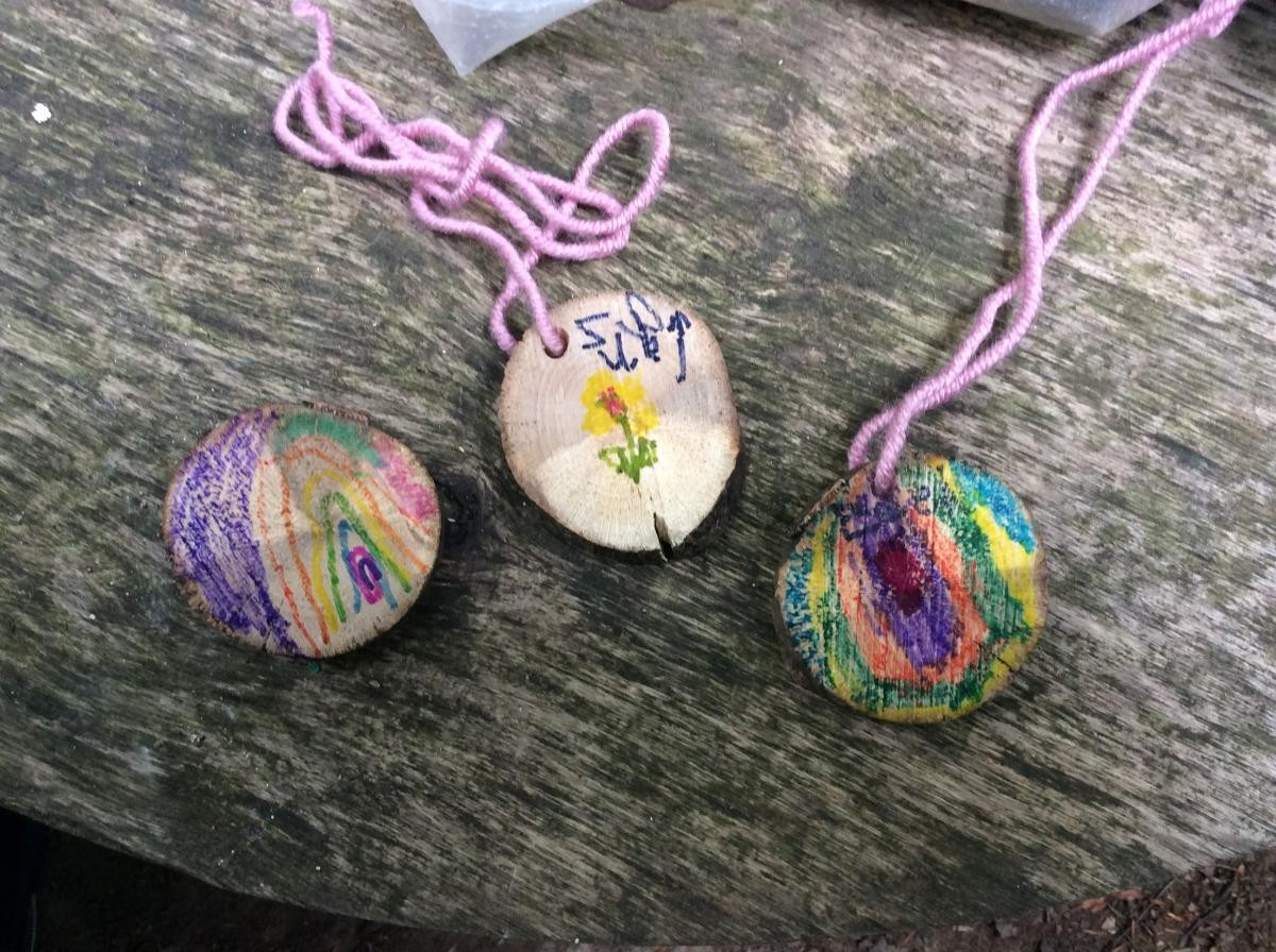 Some finished wood cookie necklaces.
