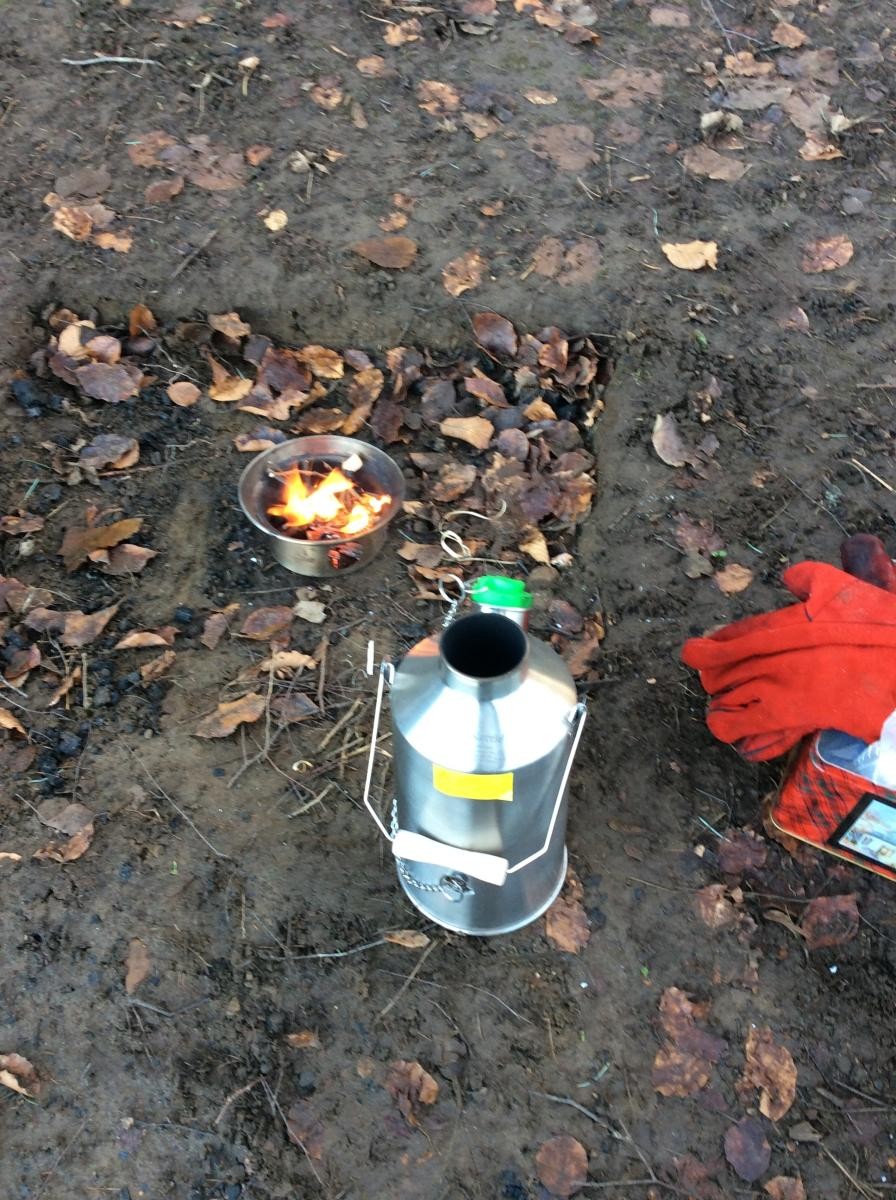 We filled the kettle with water and set it over the fire underneath.