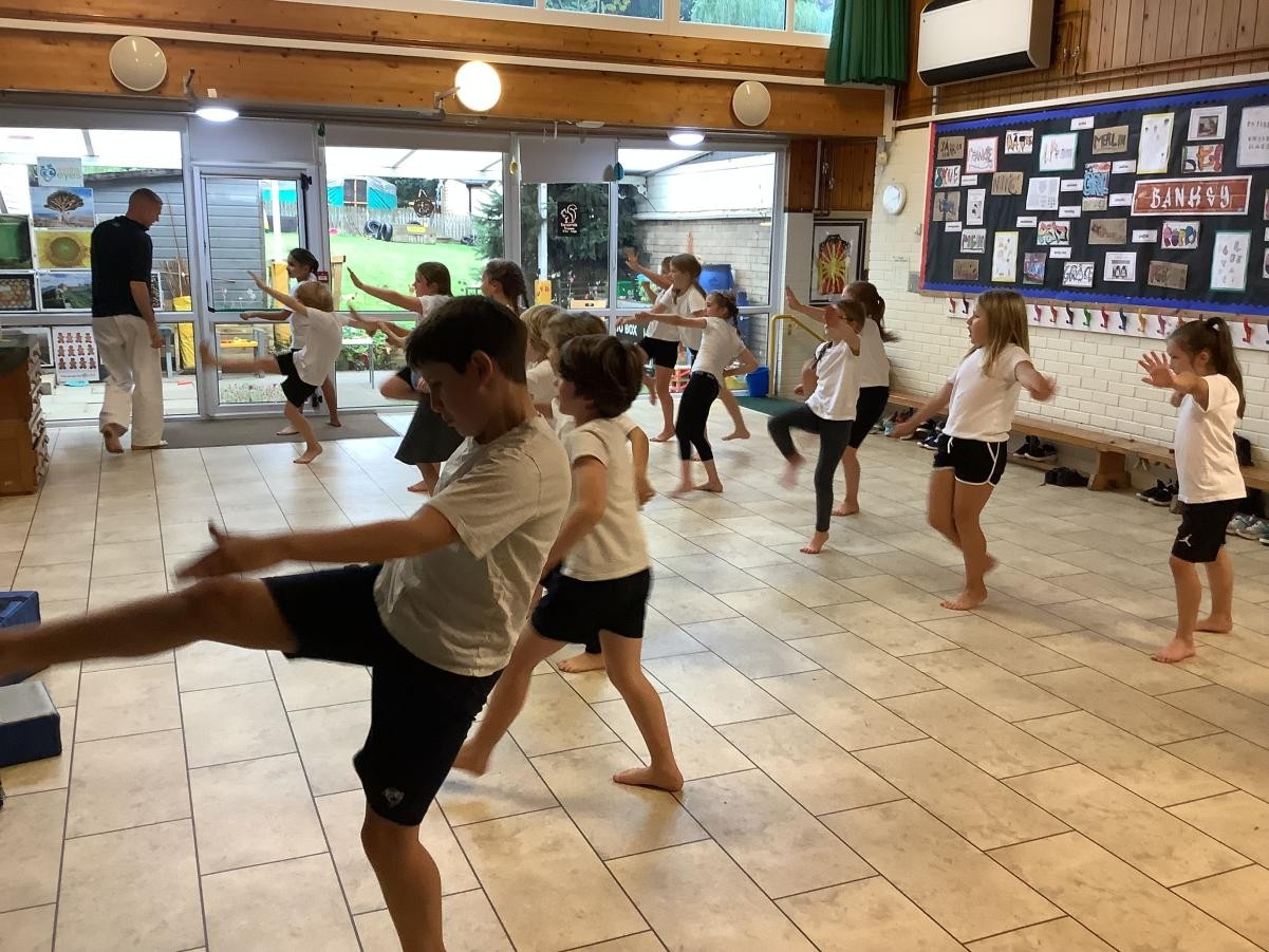 Learning to do a forward step and kick.