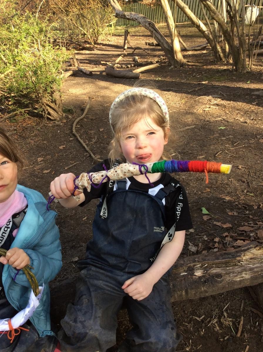 We used colourful yarn and fabric scraps to turn our willow sticks into magic wands!